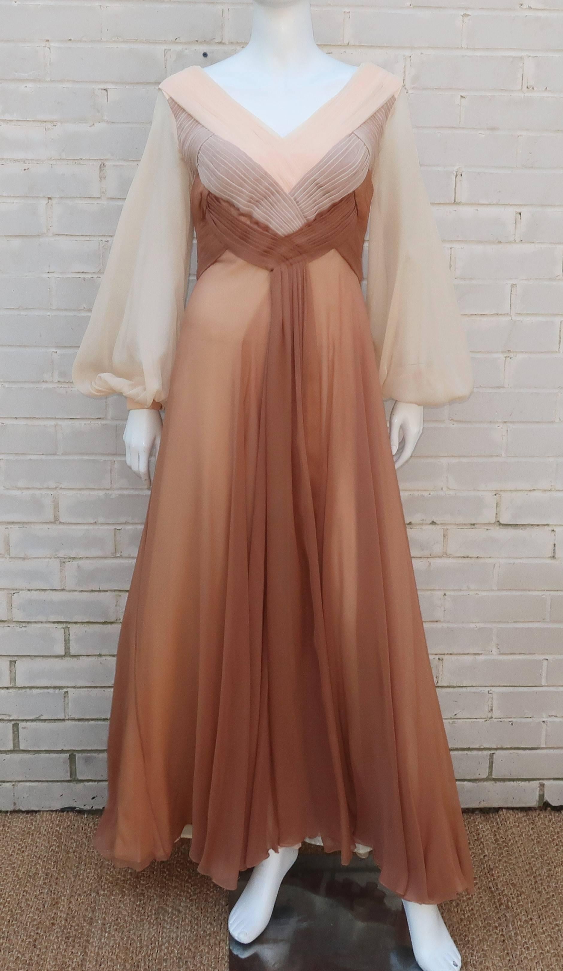 The ethereal silhouette of this C.1970 Richilene evening dress is worthy of a modern day goddess.  The dress zips and hooks at the plunging back with a crisscross style front bodice formed with intersecting flat pleats.  The varying shades of silk