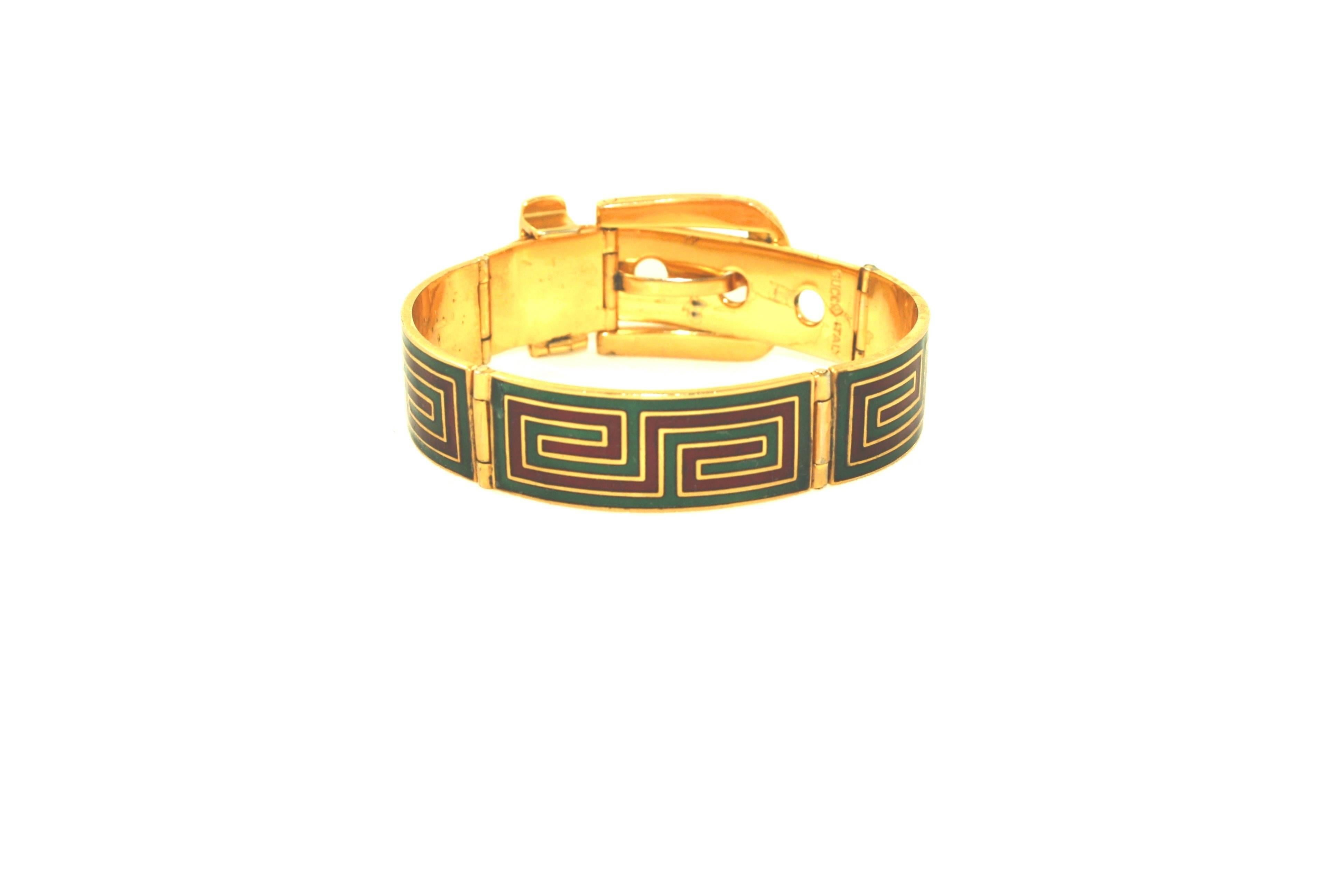 Fabulous green and red enamel panel bracelet with buckle fastening by Gucci. Marked Gucci Italy Silver. Silver with gilt plating and dated approximately 1970's. Adjustable buckle fastening, wearable length from approximately 17cm - 19cm.  