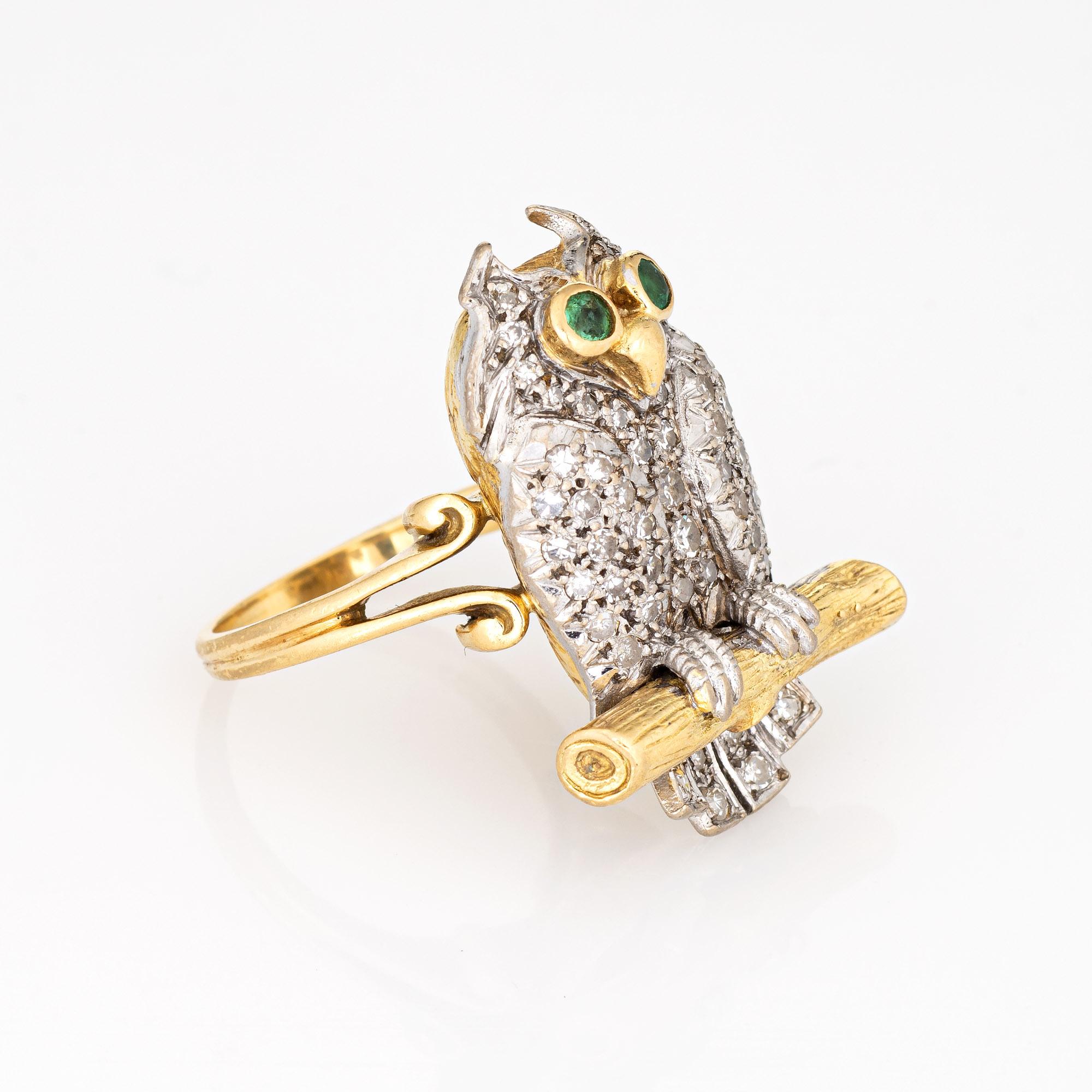 Distinct owl ring set with diamonds and green emerald eyes, crafted in 18 karat yellow gold (circa 1975). 

Single cut diamonds total an estimated 0.85 carats (estimated at H-I color and VS2-SI2 clarity). Two emeralds total an estimated 0.04 carats.