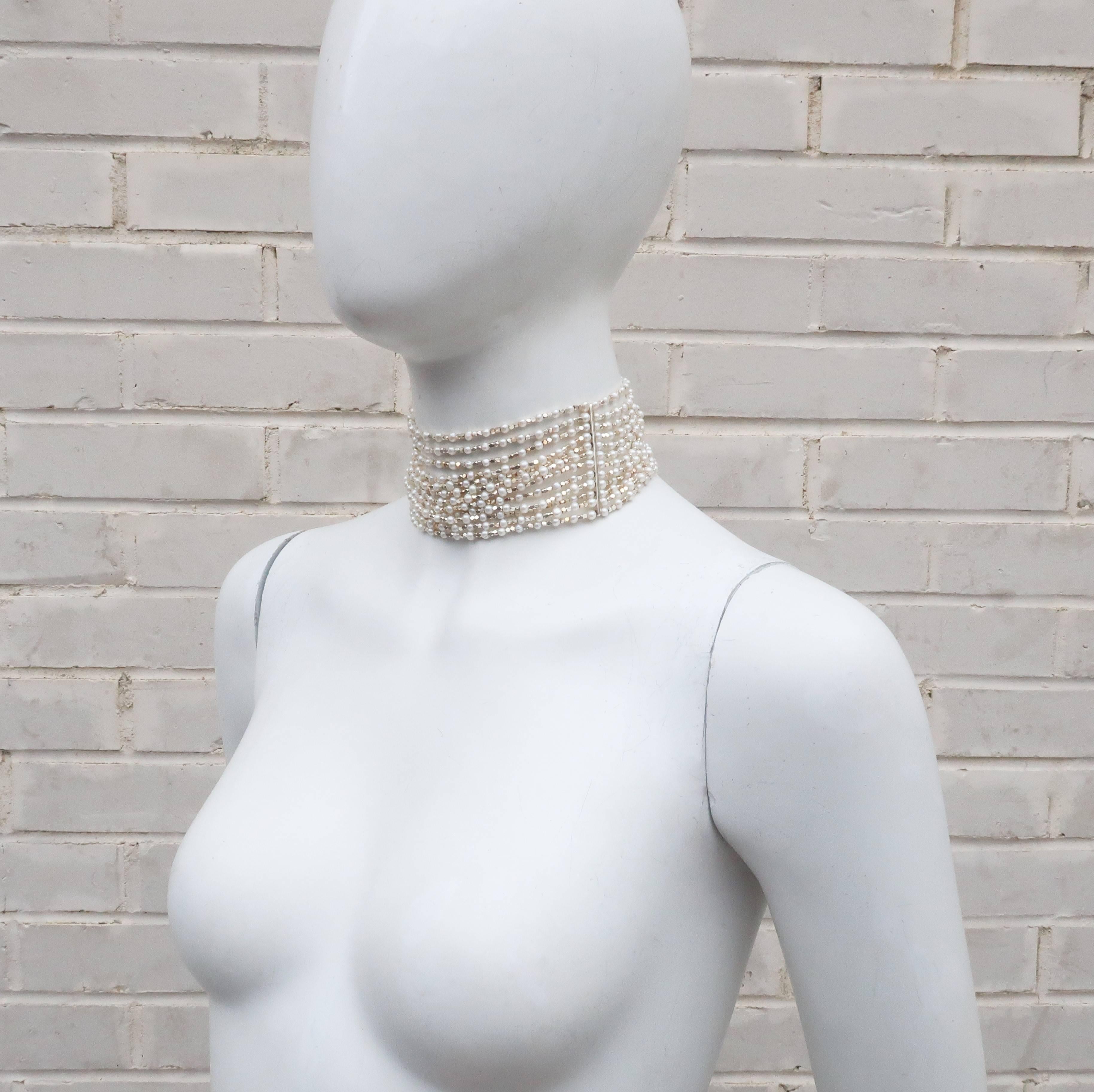 Carolee has been a trendsetting costume jewelry company since the 1970’s.  This 1980's choker style necklace has an opulent aesthetic with twelve strands of faceted sterling silver beads interspersed with faux pearls suspended by sterling silver