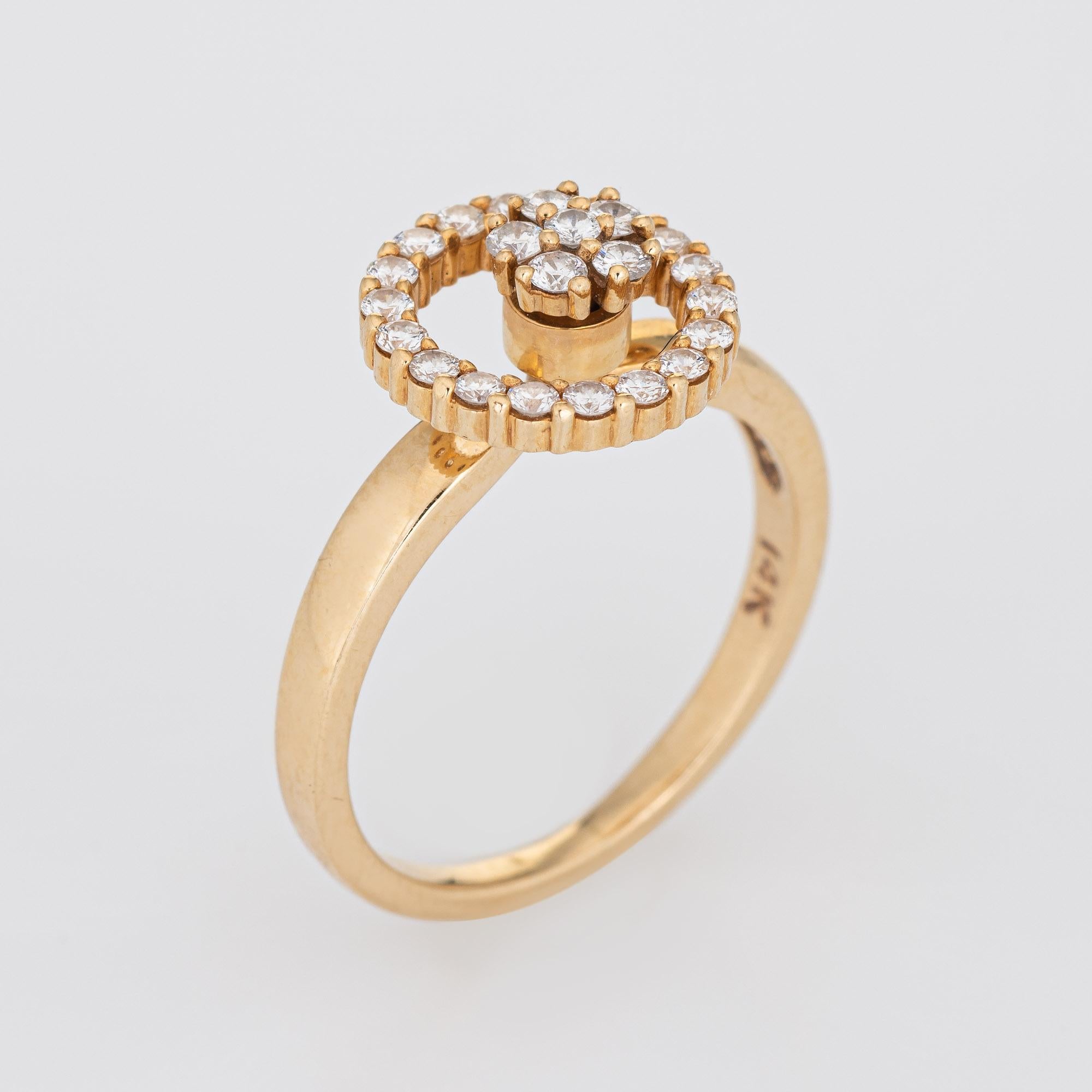 Finely detailed vintage N Teufel spinning ring (circa 1980), crafted in 14 karat yellow gold. 

Round brilliant cut diamonds total an estimated 0.25 carats (estimated at H-I color and VS2-SI1 clarity). 

In 1971 Norman Teufel created the 'swinger'
