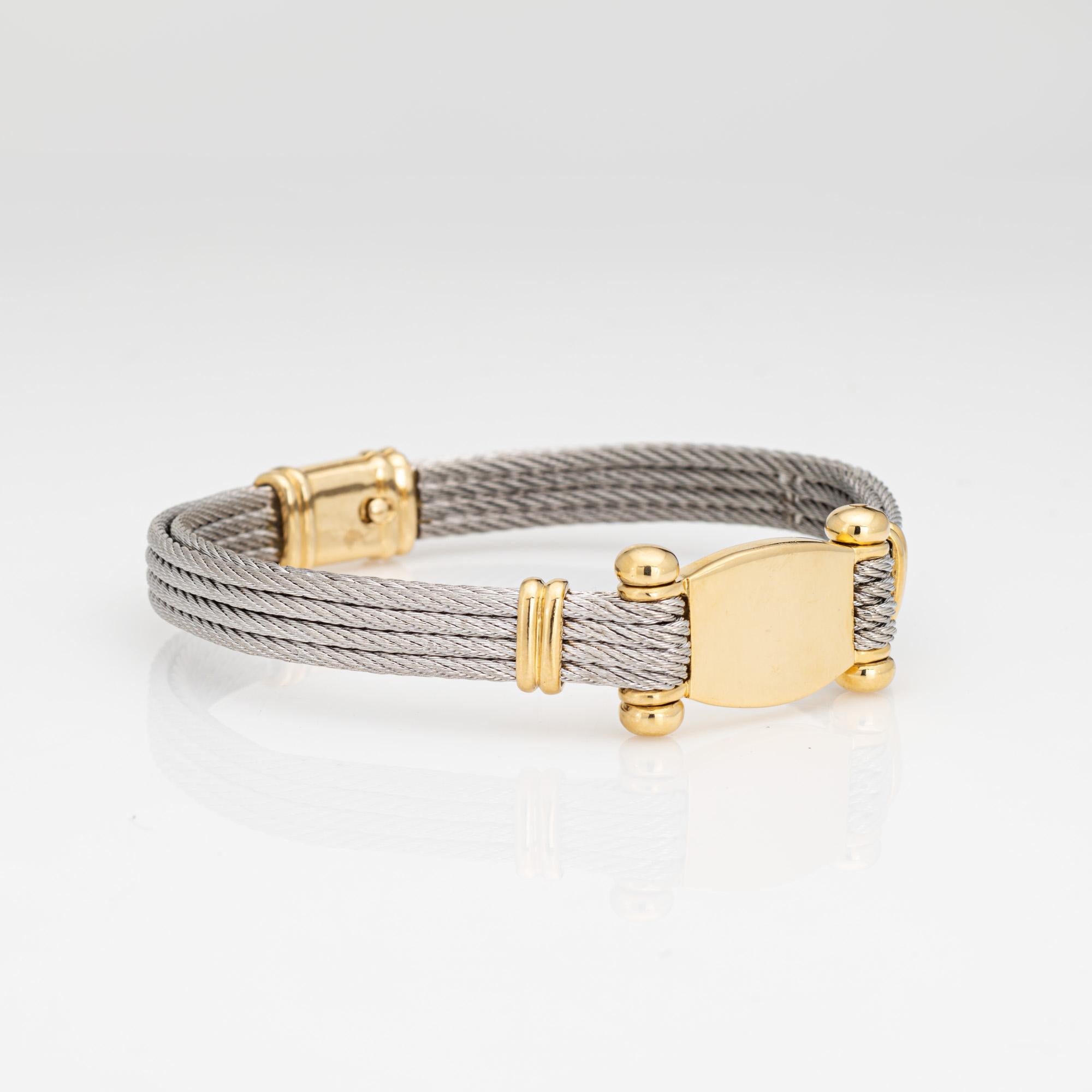 Stylish and finely detailed vintage Fred Paris 'Force 10' stainless steel & 18k yellow gold bracelet (circa 1980s). 

Crafted in stainless steel with a double sided four coiled design and 18k yellow gold accents, the statement bracelet is great worn