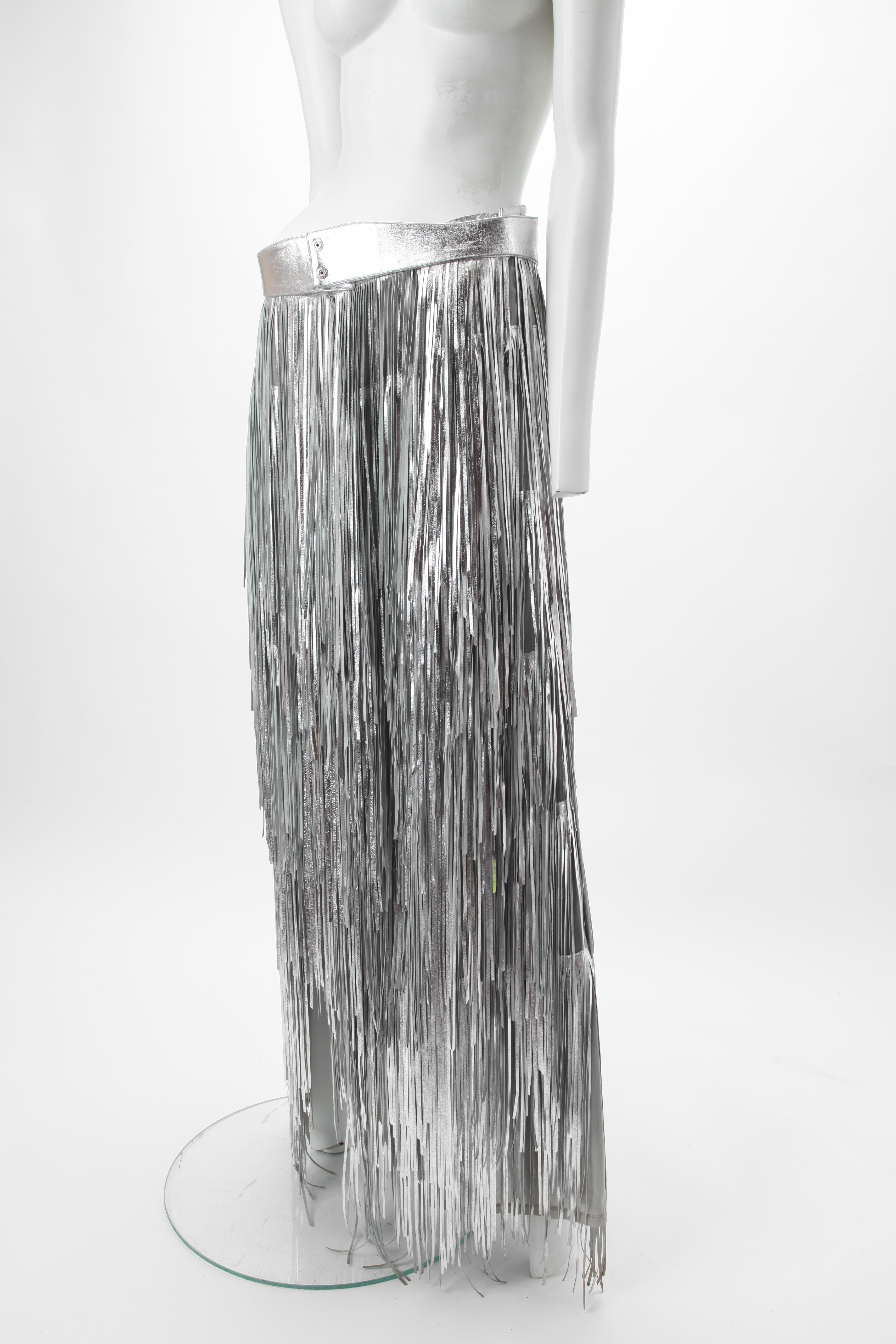 c.1980s Silver Leather Fringe Maxi Skirt, Western; Full length pencil skirt with tiered fringe; Side zipper fastening; Together with silver leather belt; Fully lined; Unlabeled. Fits US size 6