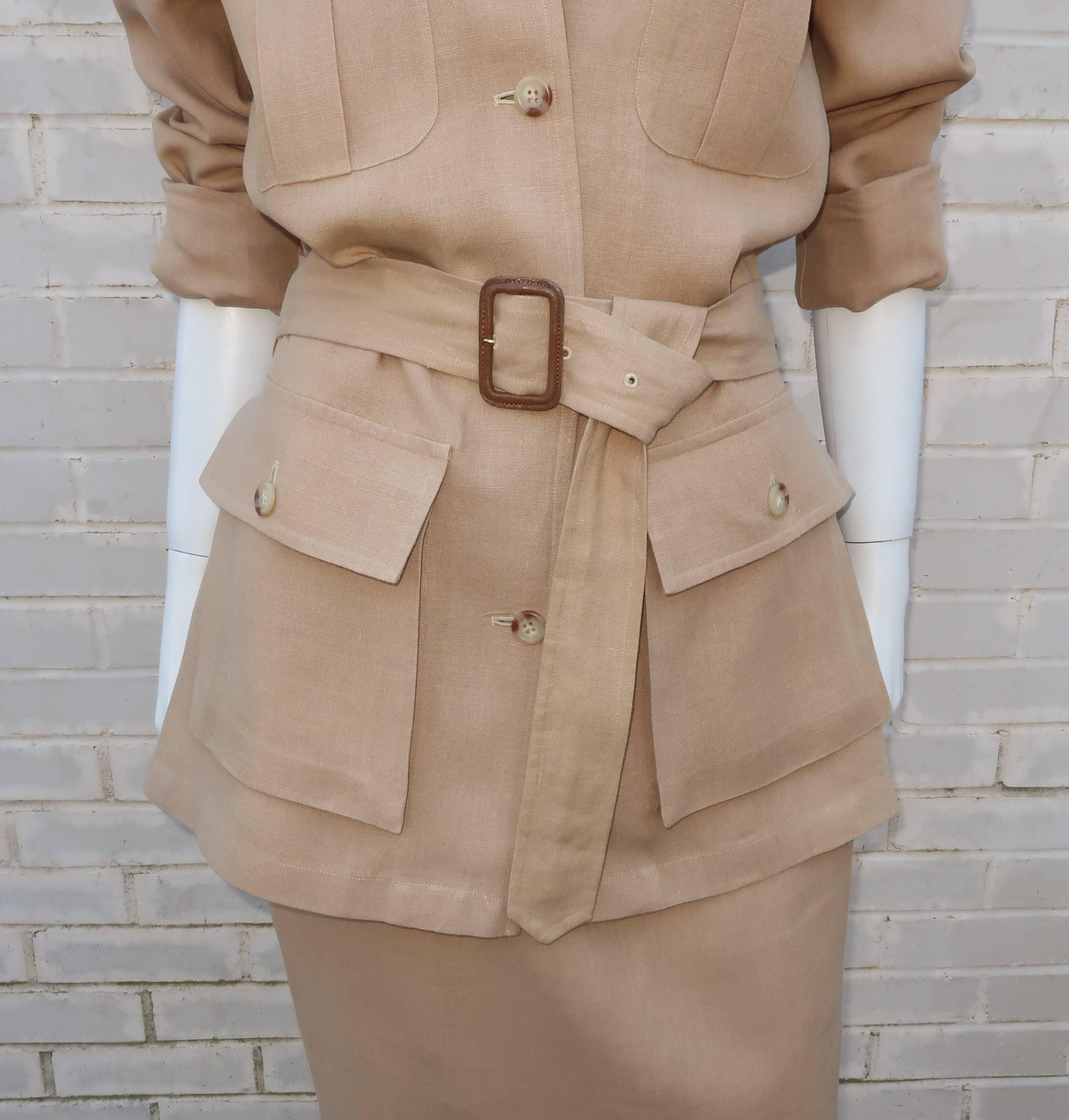 Head out for an adventure in this C.1990 Ralph Lauren two piece safari suit.  Both the jacket and skirt are fabricated from a comfortable pale khaki linen with all the details of true safari wear including a a belted waist, epaulettes at the