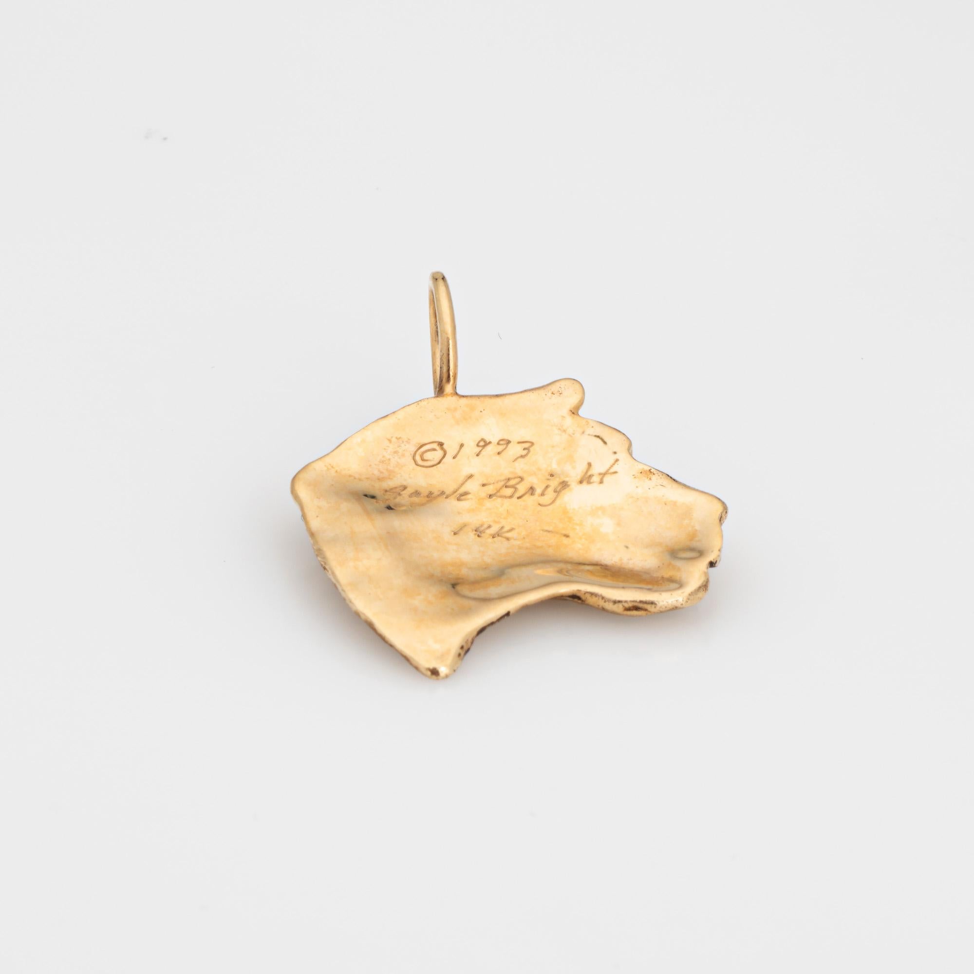 Stylish Gayle Bright Jaguar pendant crafted in 14k yellow gold (circa 1993). 

Gayle Bright sculpts gold into magical creations from the animal kingdom. The Jaguar pendant features a satin like finish with black enamel details. The matching earrings