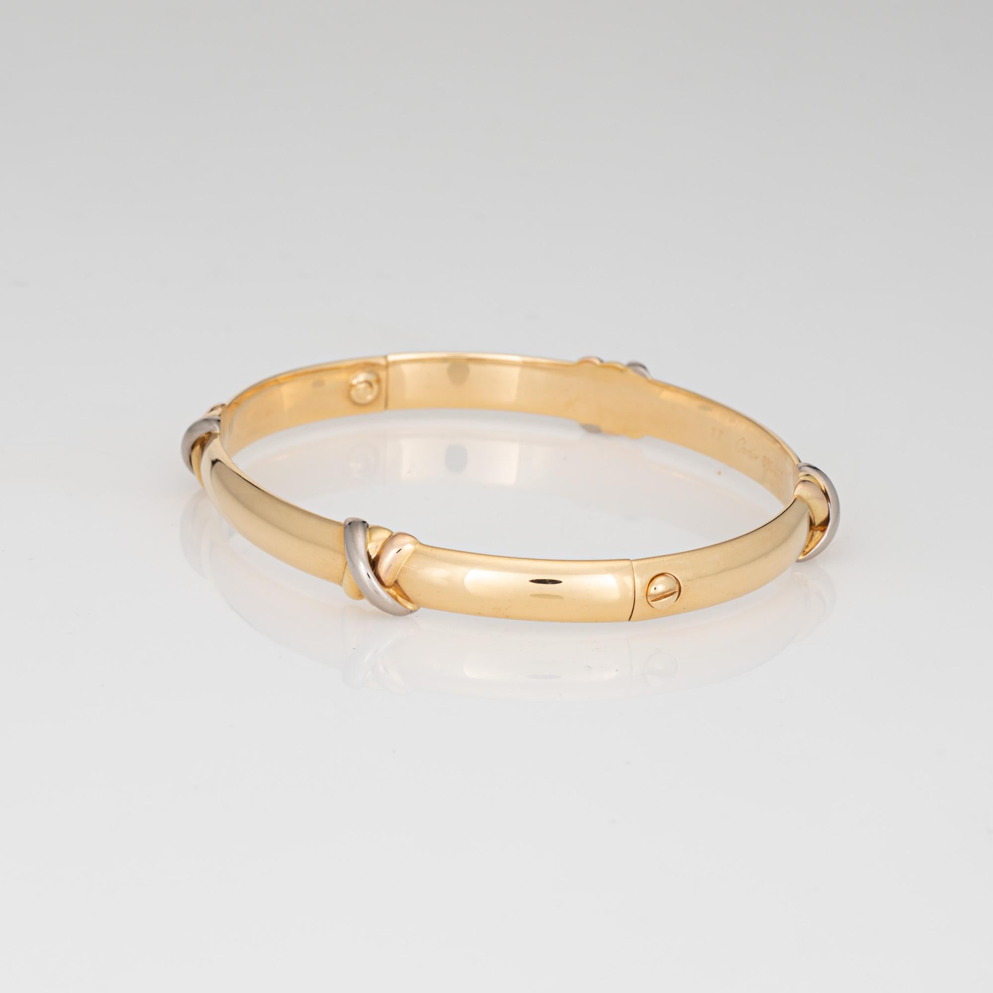 Vintage Cartier Trinity Armreif aus 18 Karat Gelbgold (mit Stationen aus Rosé-, Weiß- und Gelbgold im Trinity-Design).  

Das Trinity-Armband wurde 1995 auf den Markt gebracht und ist bei Cartier nicht mehr erhältlich. Ein klassisches Armband mit