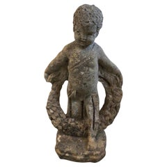 C19th Century stone Putti with wreath