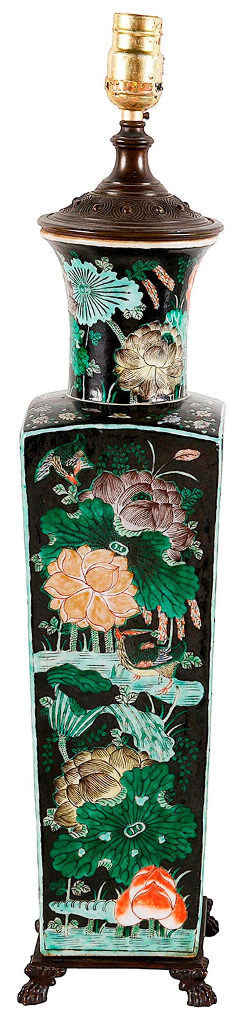 A good quality 19th century Chinese Famille Noire porcelain vase / lamp, having wonderful exotic flowers hand painted to a Black ground, a tapering form mounted on bronze claw feet. Measures: 53cm ( 21
