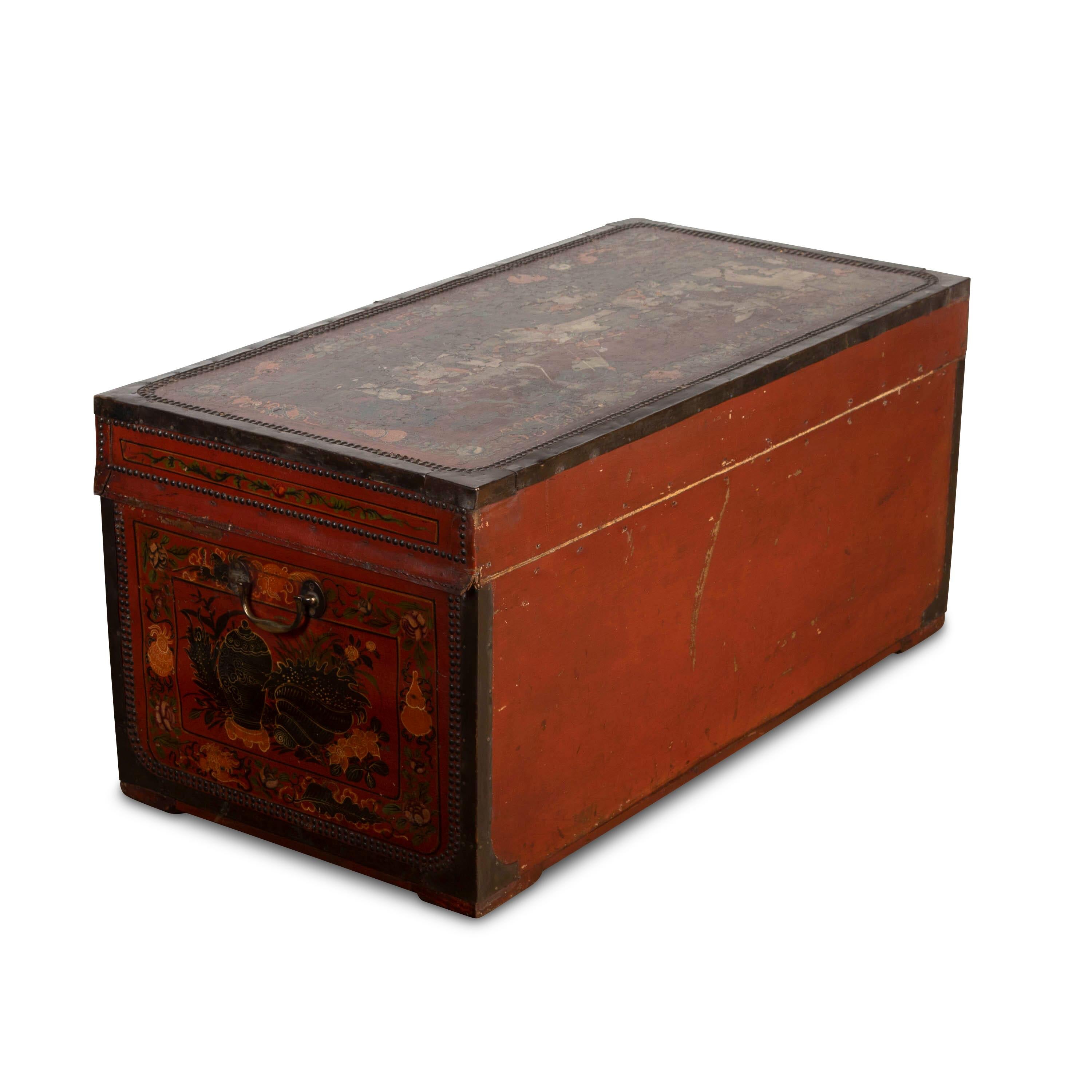 A wonderful early 19th Century Chinese export polychrome painted trunk, the leather decorated with chinoiserie scenes of figures in different activities with foliate borders and red ground. The whole brass bound and studded, with camphor interior. A