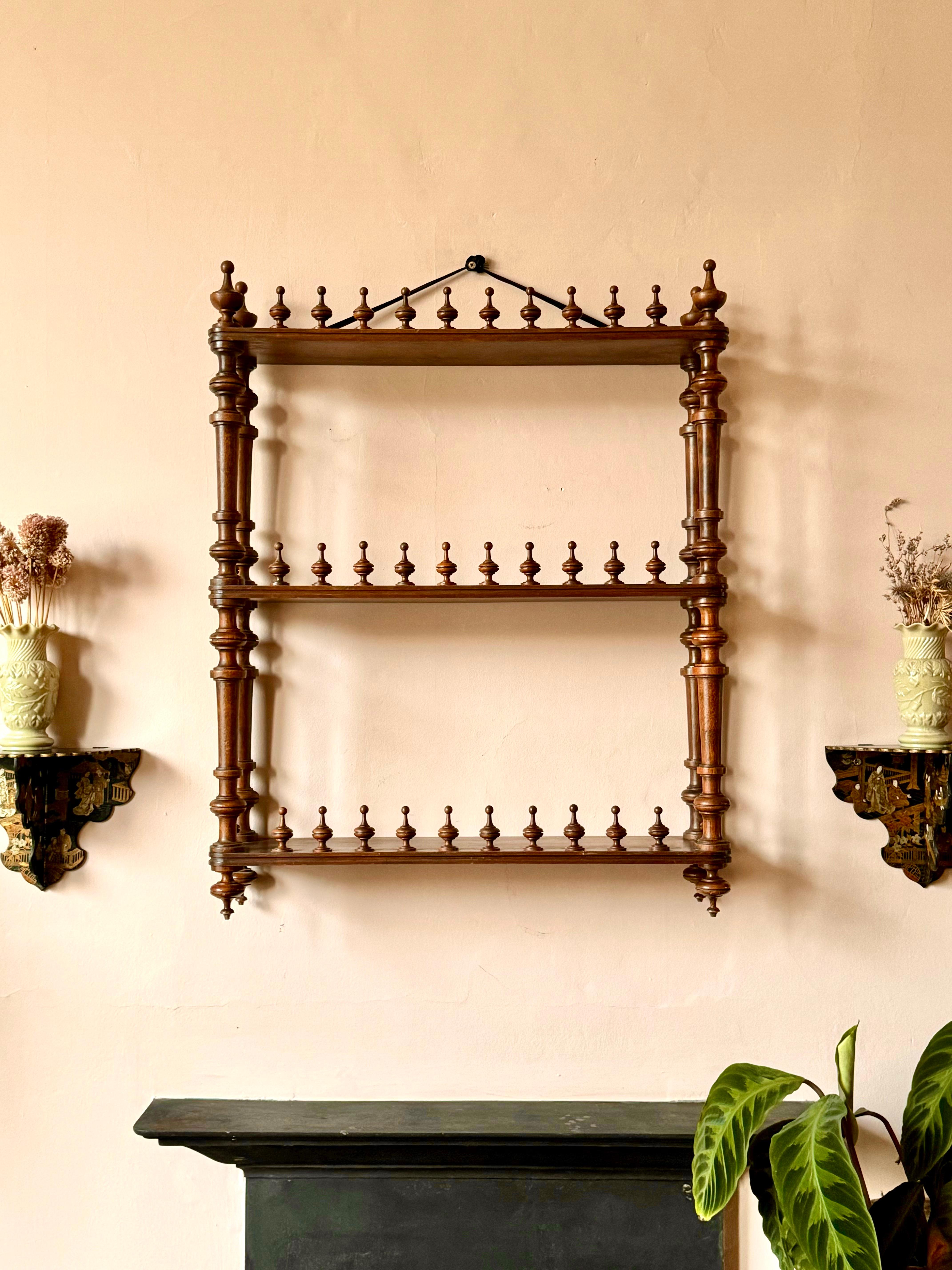 C19th French mahogany wall shelf.

Gorgeous Napoleon III three tier étagère with an abundance of wonderful turned finials. 

In excellent and sturdy condition with very light wear.