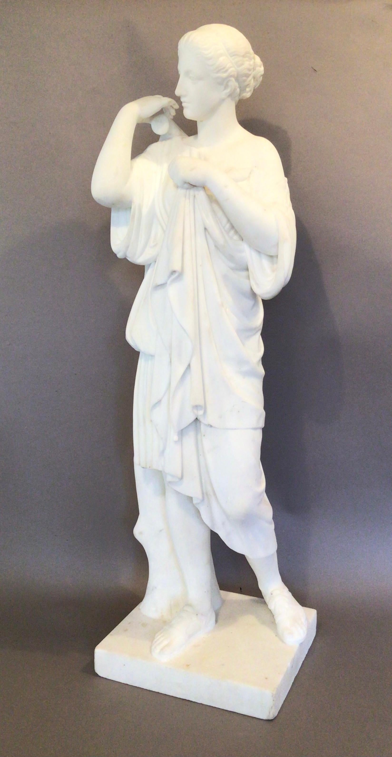 Early C19th ‘Grand Tour’ statue of ‘Diane de Gabies’, finely carved in Carrara marble. Diane stood next to a tree stump with her hair tied back and her head tilted to the right where she is fixing the clasp on her tunic. 28