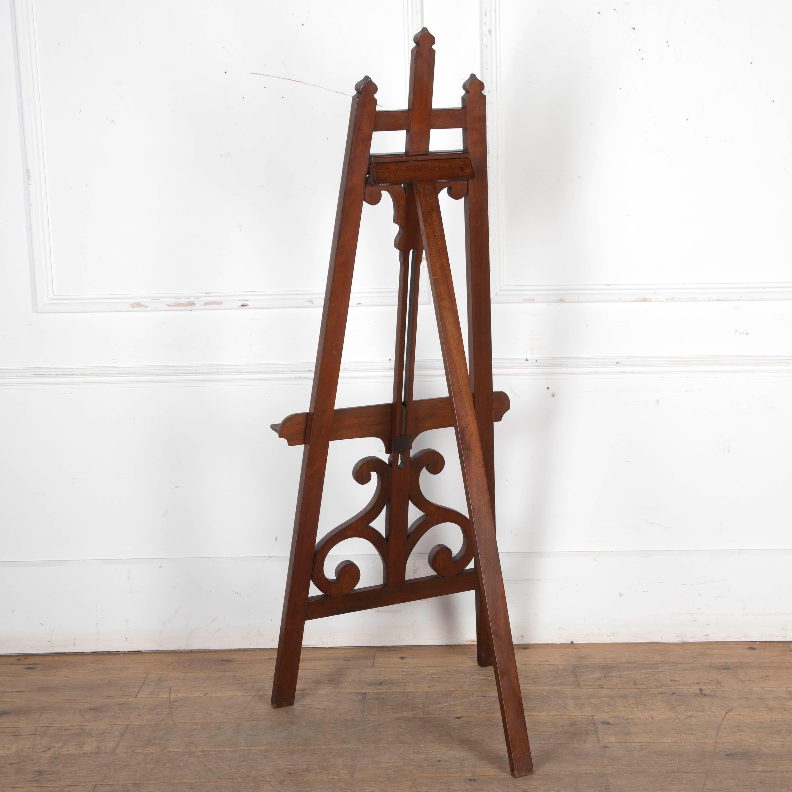 A good quality C19th mahogany gallery easel, the tapering supports with pagoda capitals, 
the central support with swept scrolls to the top and further S shape scrolls to the base and holds the adjustable picture rest with brass knob. Circa