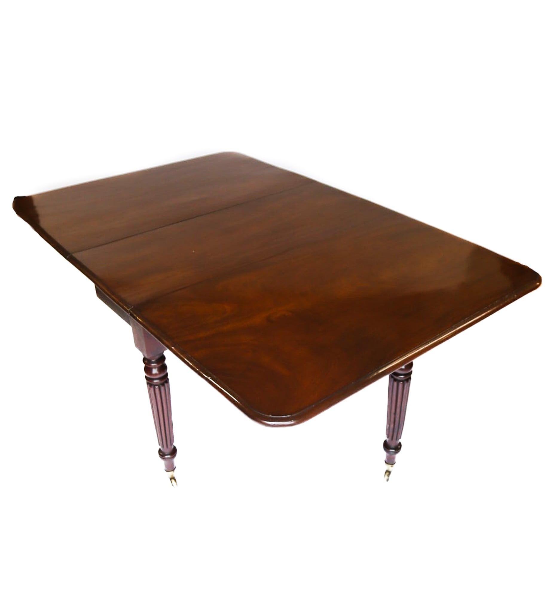 C19th Mah Reeded Leg Drop leaf Dining table circa 1820s
Cuban Mahogany top,
pair of Legs with  Gate leg action on Hinged Knuckle joints ,to
Hold Drop leaf tops, 
Reeded Legs, Brass cup Castors
Very good quality Timber
Recently Polished
Seats 6