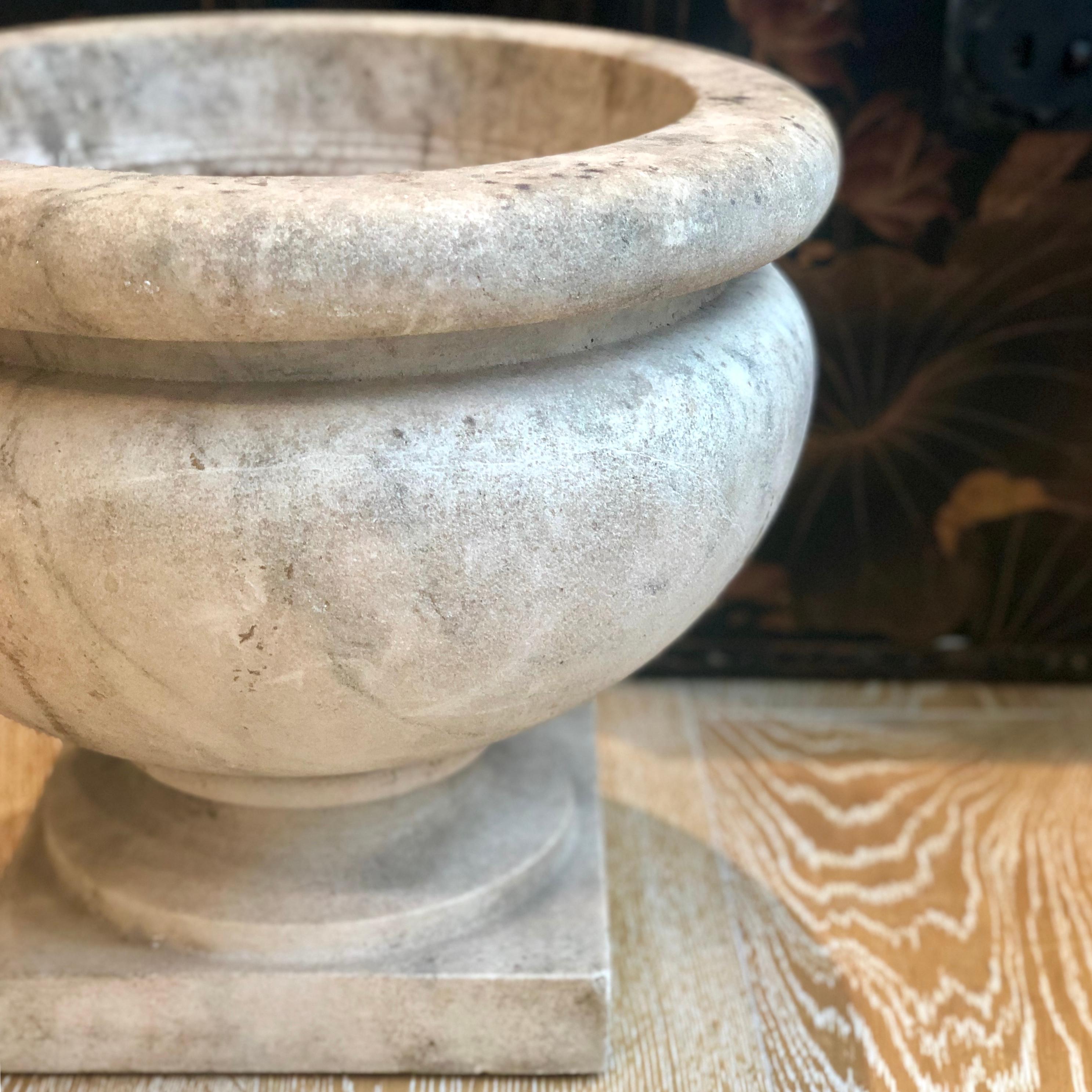Grey marble round planter pot from the mid-1800s on a stand.
Good antique condition considering the age.