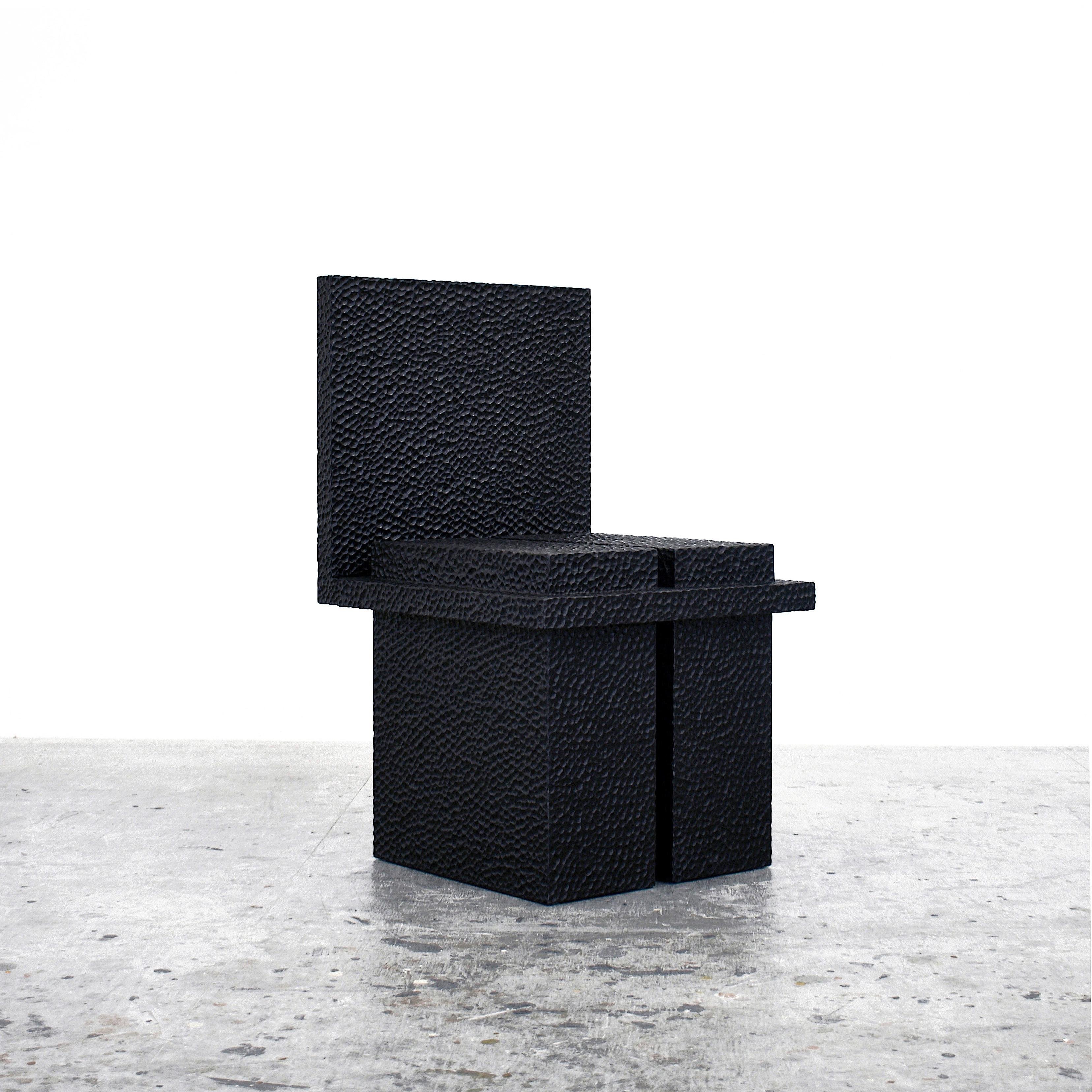 C2 chair by John Eric Byers.
Dimensions: 49.5 x 45.8 x 77.5 cm
Materials: carved blackened maple

All works are individually handmade to order.

John Eric Byers creates geometrically inspired pieces that are minimal, emotional, and modernly