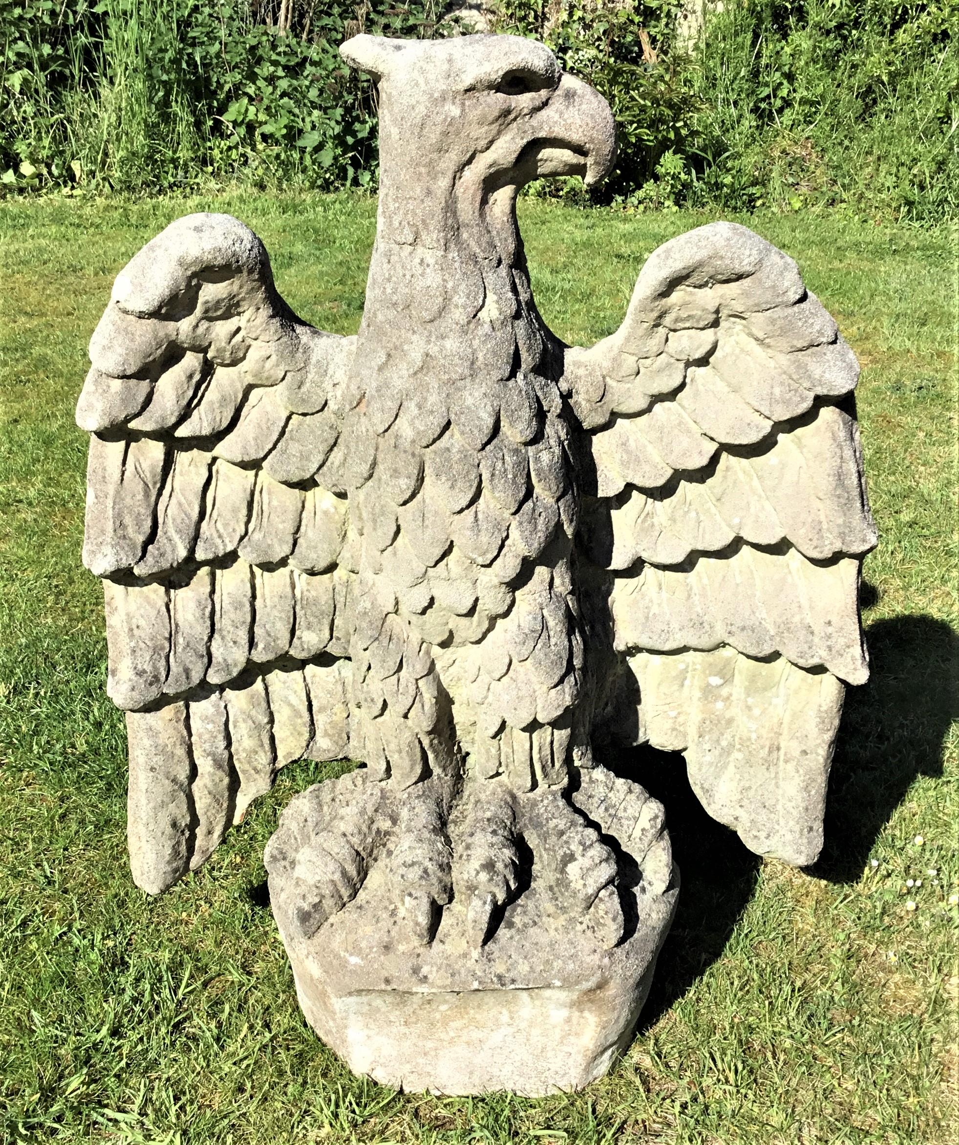 An impressive, large composition stone eagle, naturally weathered, with his head turned to the side and his wings outstretched, perched on an outcrop.
English circa 1920
Good condition
Dimensions (ins) 39 high x 30 wide x 17 deep.
  