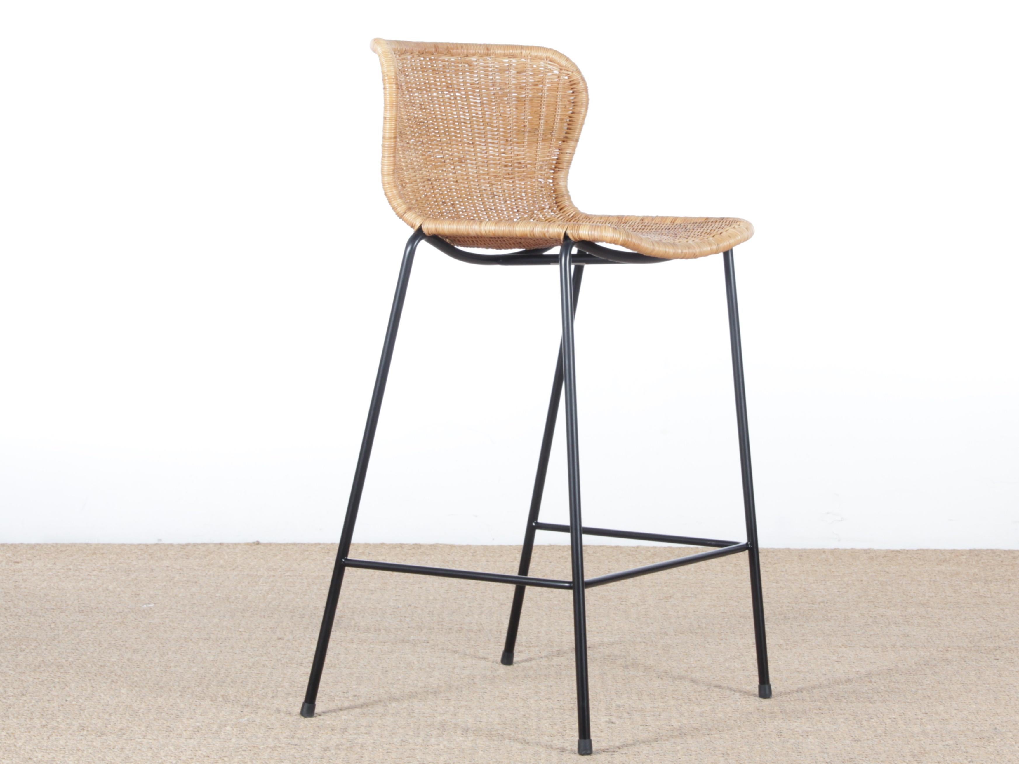 The C603 bar stool is a variation of the C603 Chair by the Japanese designer Yuzuru Yamakawa designed in 1958. A true icon of design, it has been reissued since 2017.

Black lacquered steel structure. Braided and varnished rattan.

Exists in