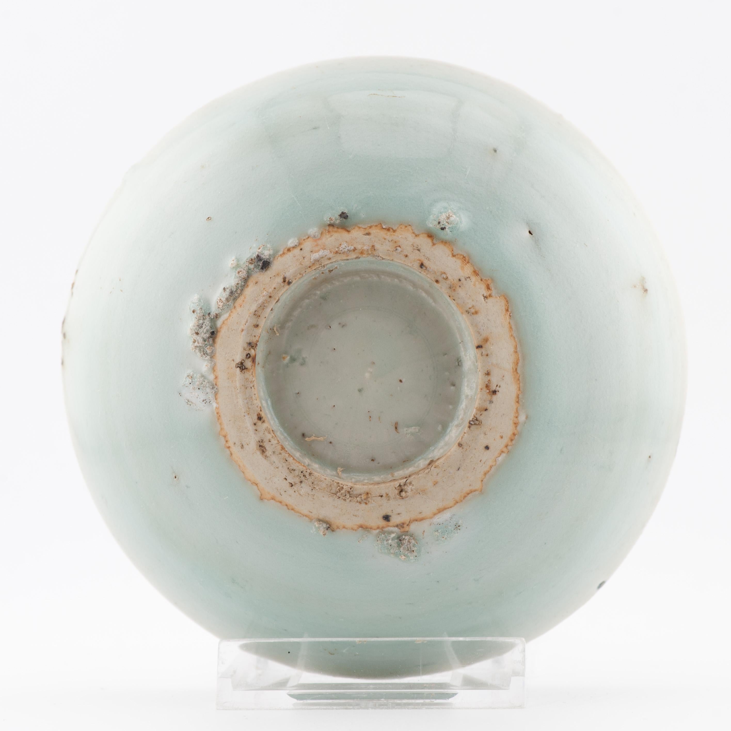 A very nicely decorated small dish, dating to ca 1500, Hongzhi or Zhengde period.

The small saucer dish is decorated with a raised moulded goldfish coloured in orange-red enamel and surrounded by water plants in cobalt blue.
This type seemed to be