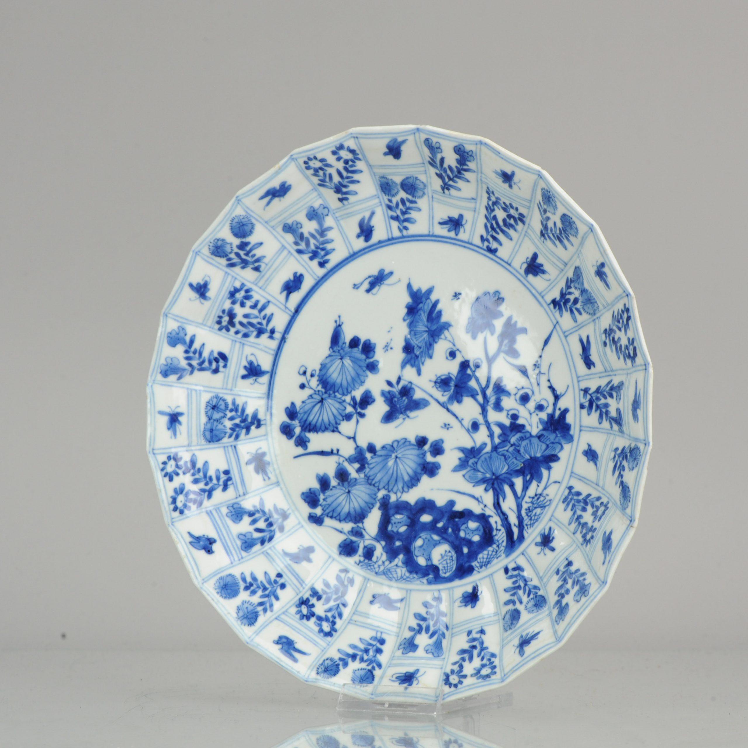 Blue and white porcelain deep plate, decorated with flowers, butterflies and birds. Absolutely top quality plate and rare design and shape. Marked at base with a YU mark. China, Kangxi. Blue and white porcelain deep plate, decorated with figures and