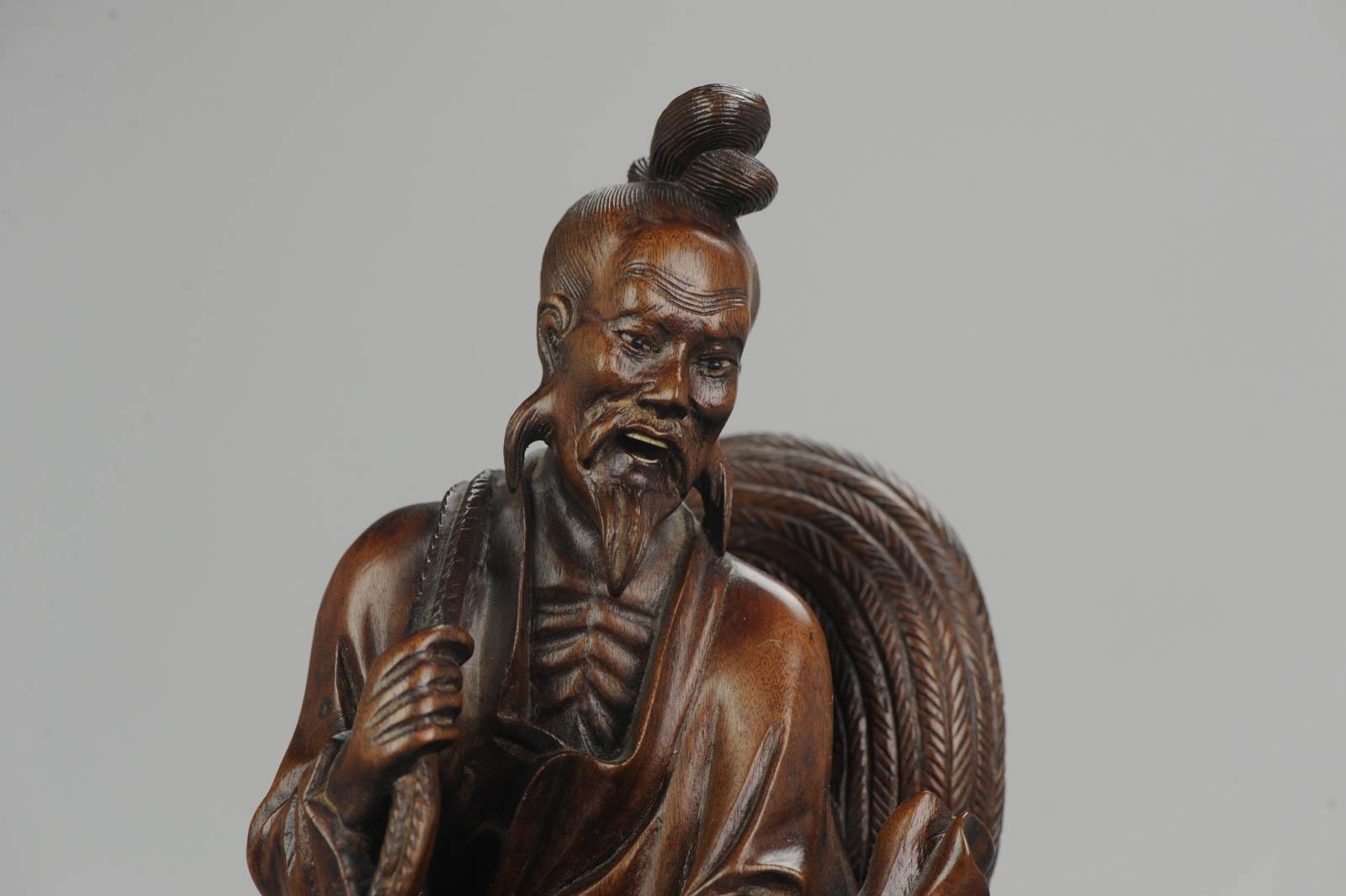 Statue chinoise en bois sculpté représentant un pêcheur:: son fils et une grue:: vers 1900 10