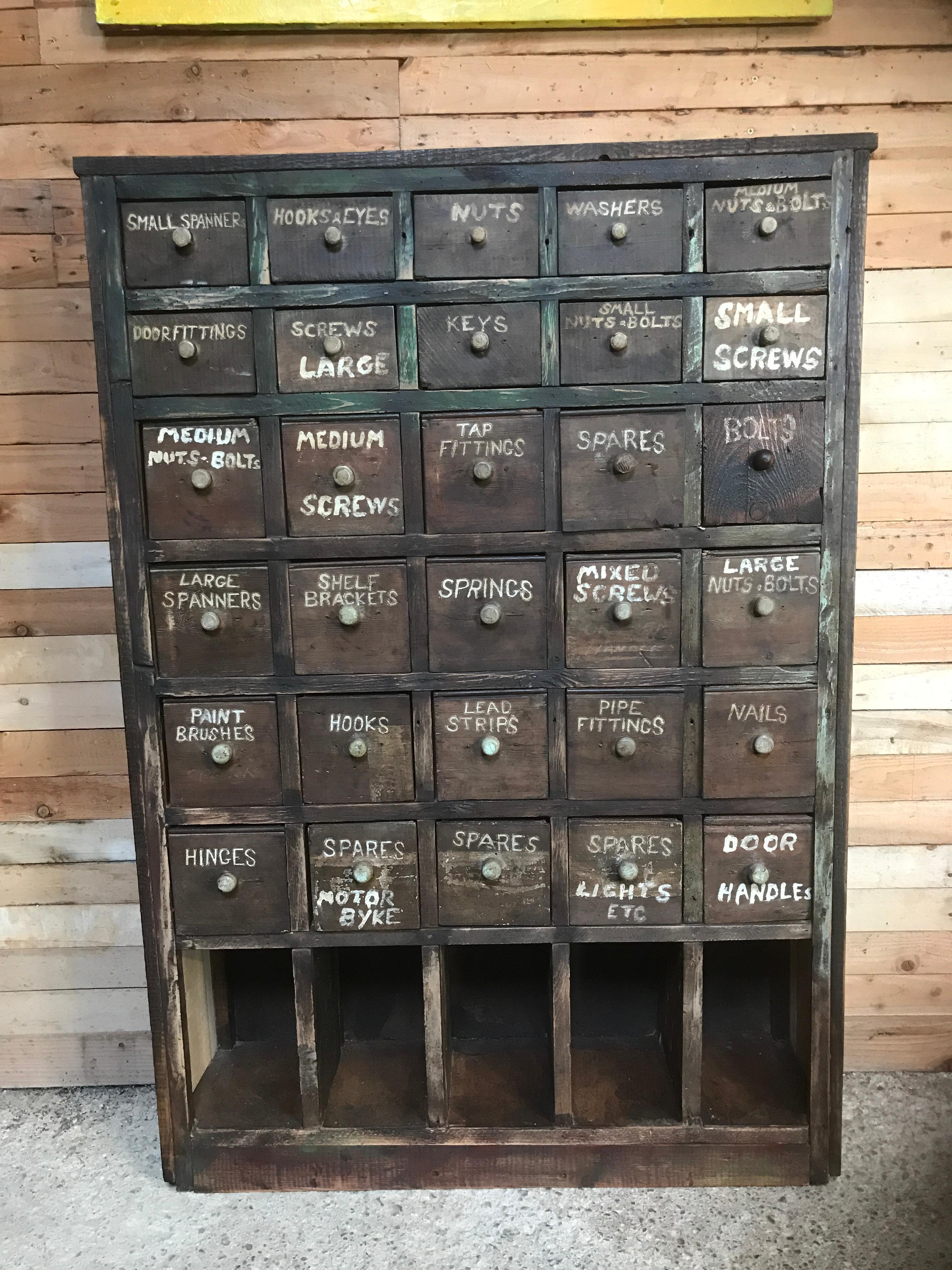 Ca 1900 Vintage industrial workshop pigeon hole cabinet, lots of drawers, lots of dents, scratches and everything else to make this unit look fab!! 

Height 139cm, Depth 25cm, Witdh 96cm