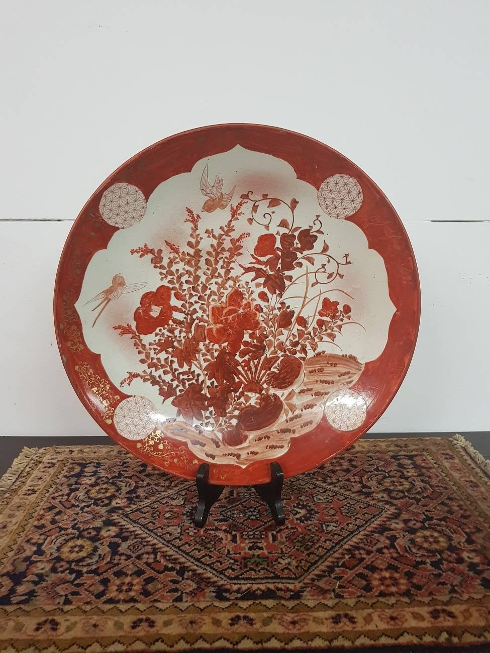 Large size Japanese Kutani marked porcelain plate from circa 1930 with a hand-painted decoration of birds and flowers (in mint condition only slight wear on the paint).

The measurements are:
Depth 37 cm/ 14.5 inch.
Width 37 cm/ 14.5
