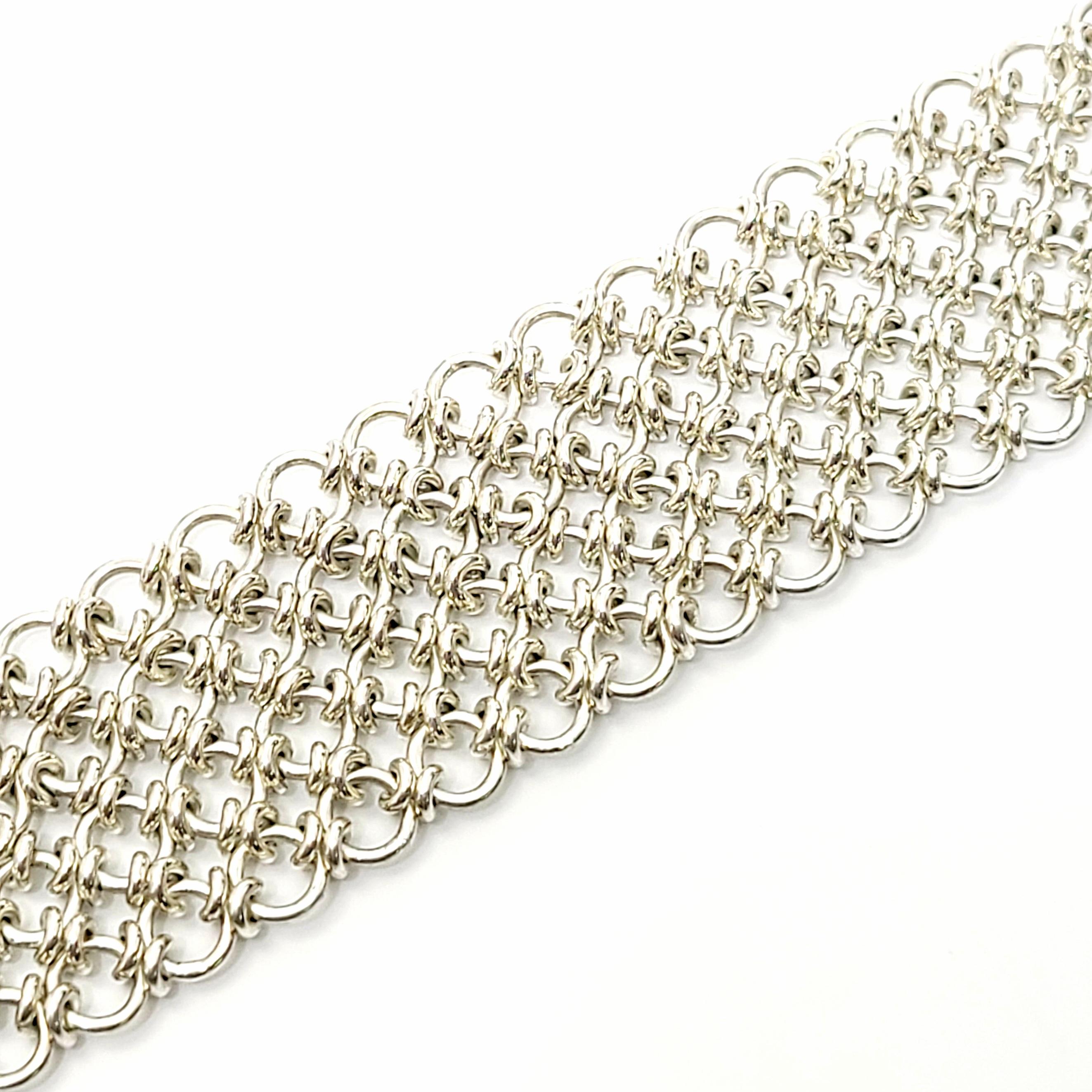Wide sterling silver mesh cuff bracelet by CA Canada.

Beautiful wide, yet delicate chain link mesh bracelet. Slide bar closure with figure 8 safety clasp.

Measures approx 7 1/4