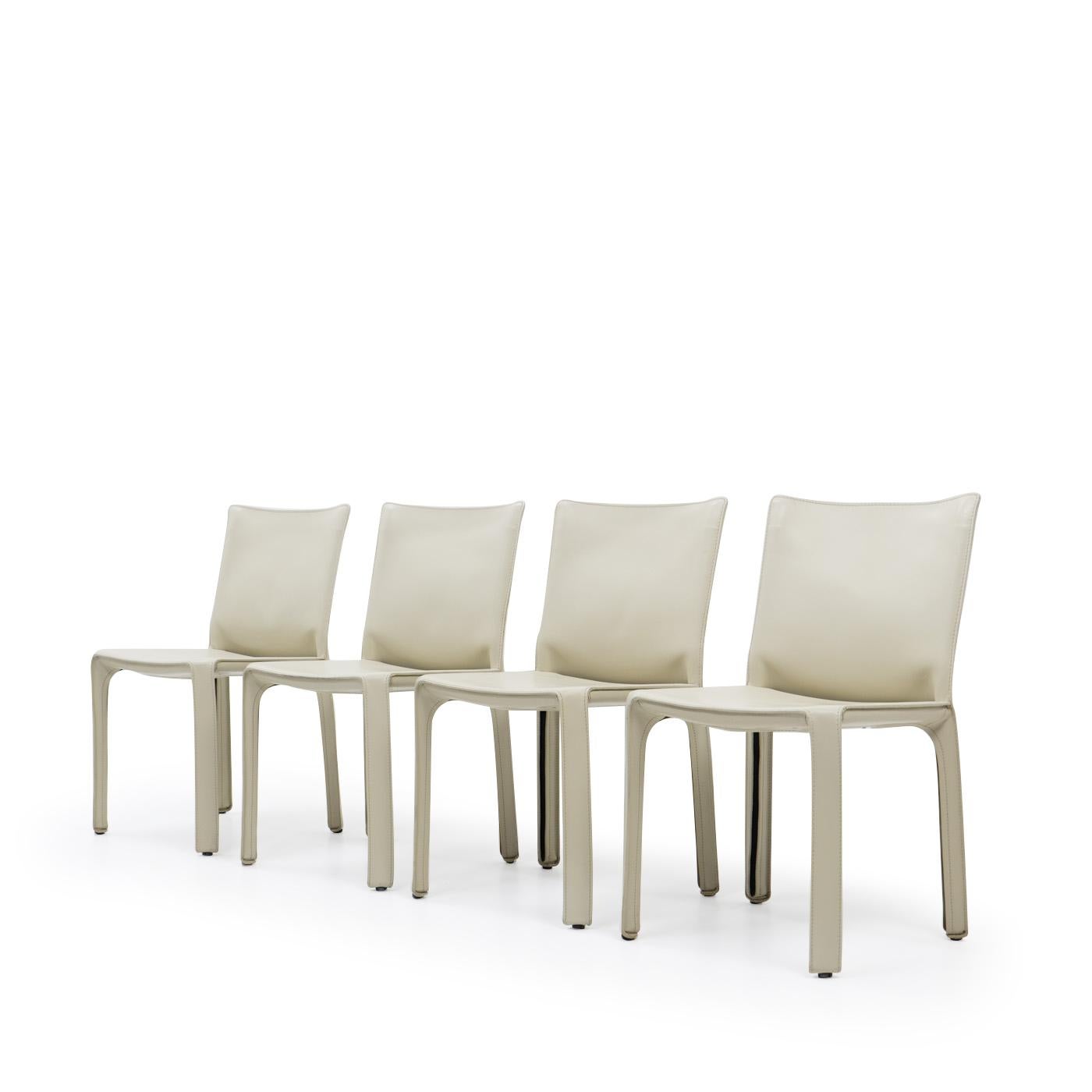 Set of four Cab 412 side chairs in cream leather by Mario Bellini for Cassina.

The Cab chair is built up as a tubular frame over which thick saddle leather is fitted; the leather skin is kept in place with zippers on the inside legs.

A wonderful