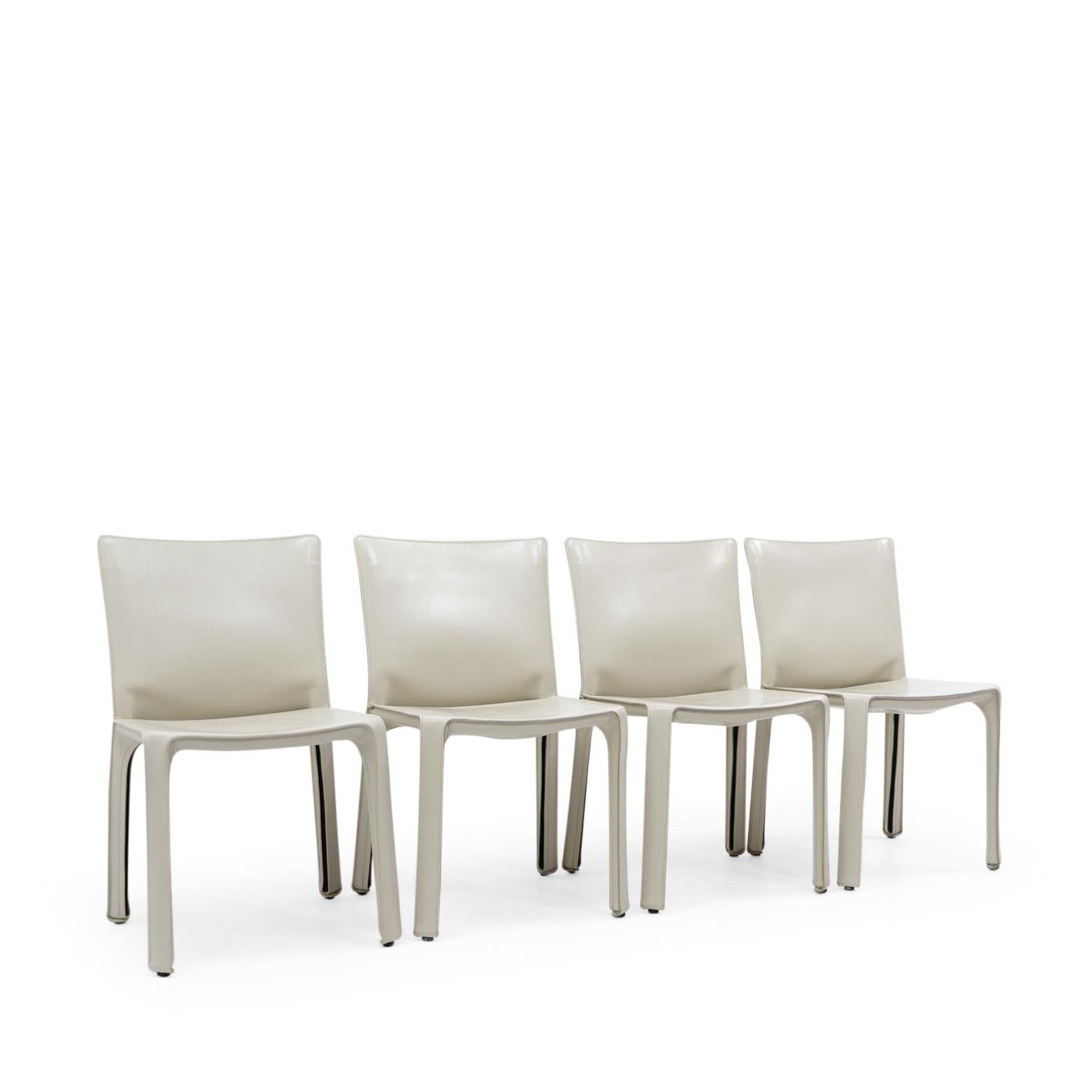 Set of four Cab 412 side chairs in cream-coloured leather by Mario Bellini for Cassina.

The Cab chair is built up as a tubular frame over which thick saddle leather is fitted; the leather skin is kept in place with zippers on the inside legs.

A