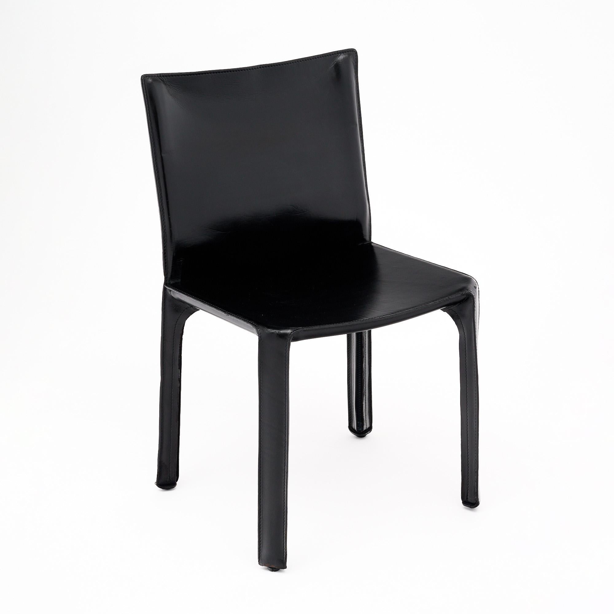 Set of six dining chairs in the iconic Cab-412 design by Mario Bellini for Cassina. Originally designed in 1977, this chair features saddle leather upholstery that undergoes hand-processing and is hand-fitted and stitched to a steel interior