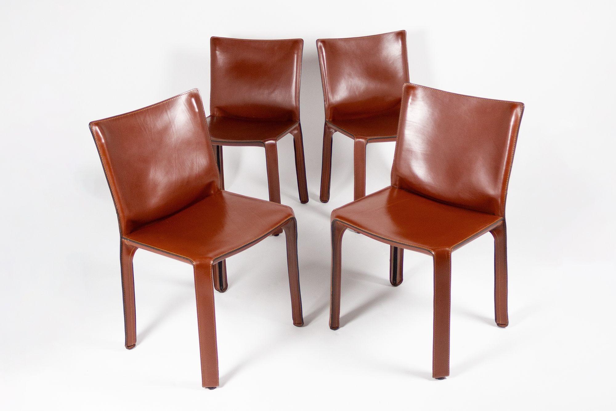 Classic Cab chairs model 412 designed by Mario Bellini for Cassina. Chairs are in very good condition with the original saddle leather upholstery.