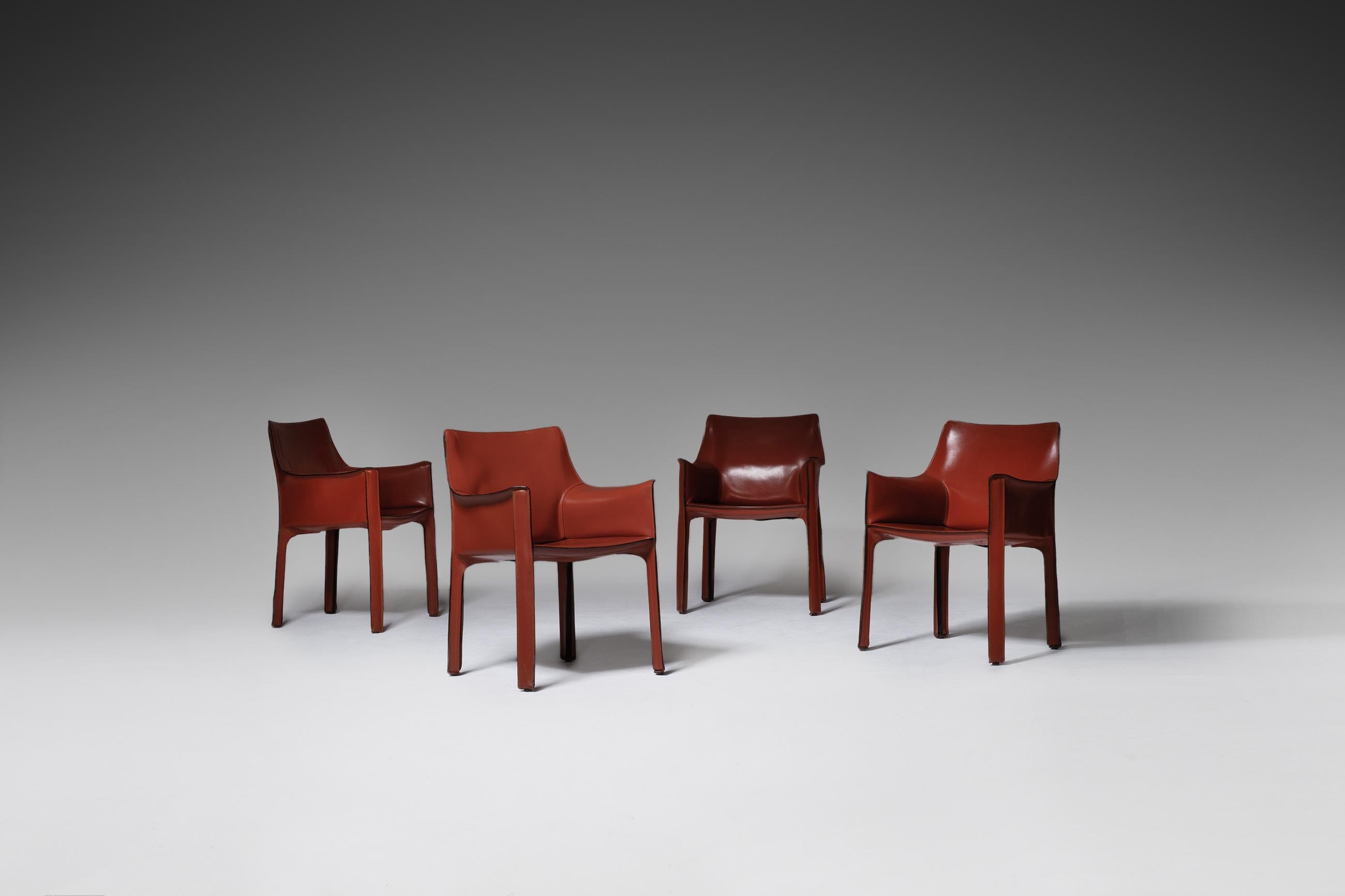 Set of four “413 - Cab Armchairs” by Mario Bellino for Cassina, Italy 1977. The chair consist a steel frame which is completely wrapped by high-quality natural cognac / red coloured leather, resulting in these icon and extremely comfortable chairs.