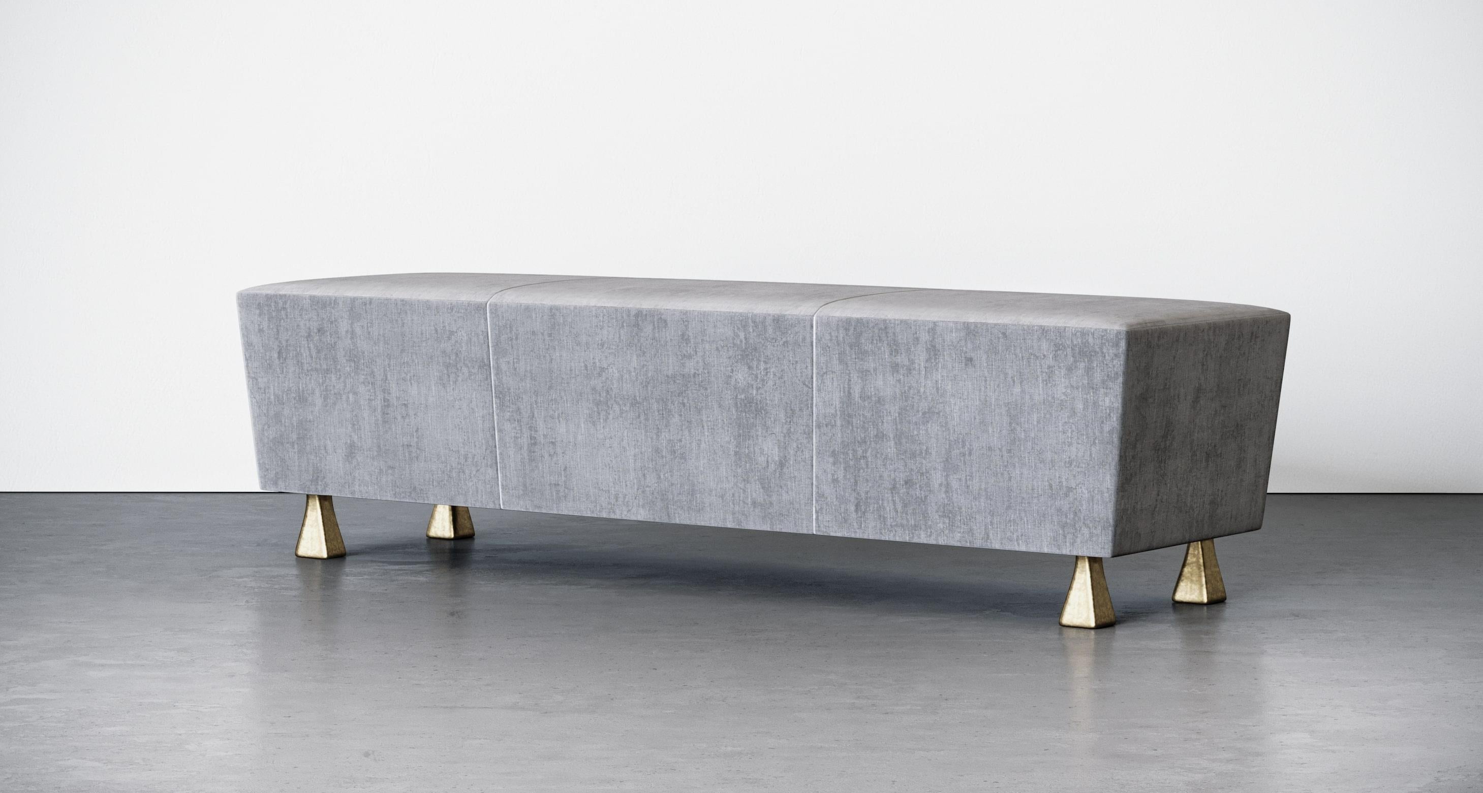 Caballa bench by Aguirre Design
Dimensions: L 163 x W 36 x H 43.2 cm
183 x W 45.7 x H 43.2
Materials: Fully upholstered blind stitches
 Tight seat with angled corners
 Cast bronze squared legs

Combining traditional craftsmanship and