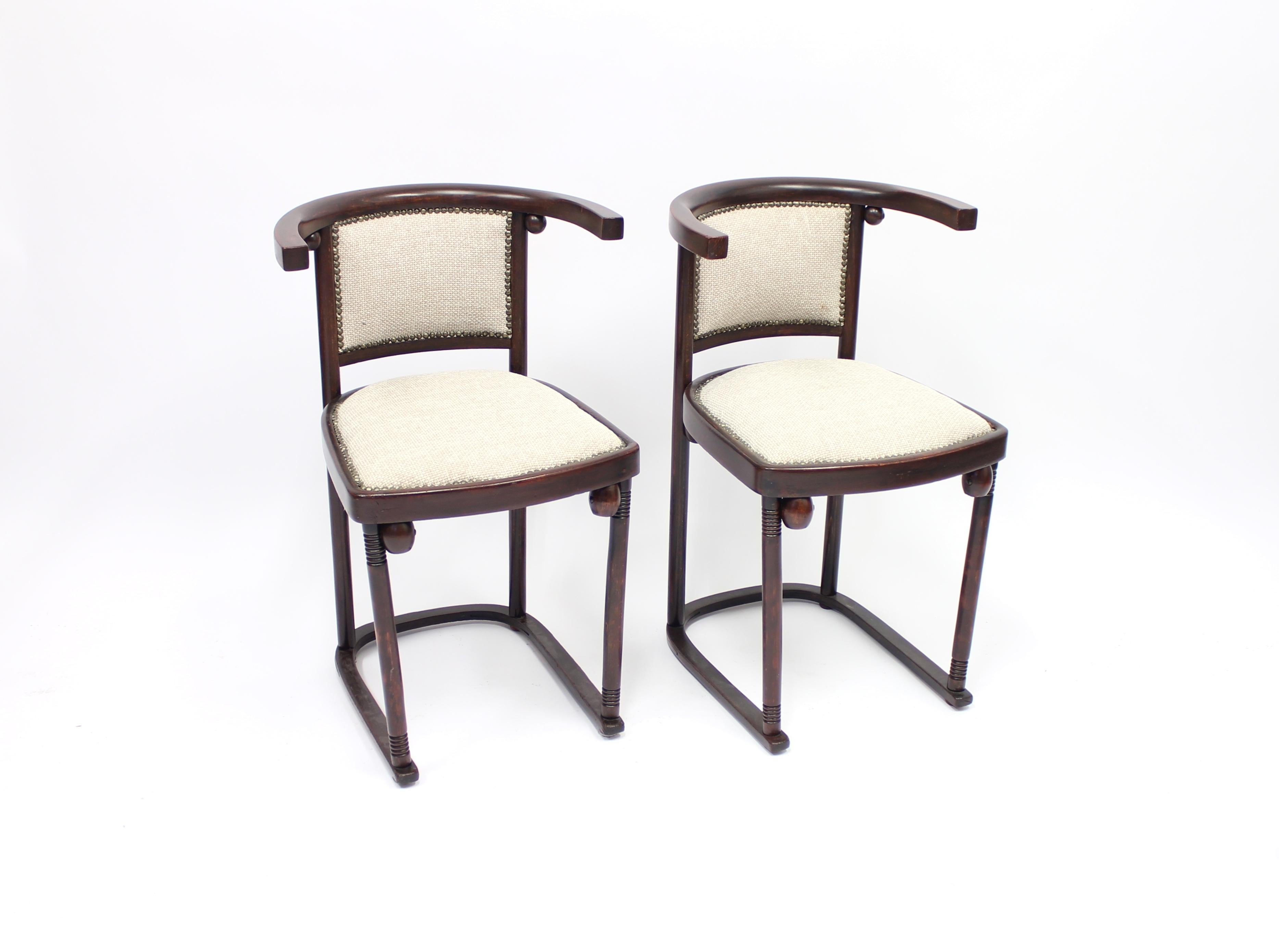 These two chairs were designed by Josef Hoffmann in 1907 for the famous Cabaret Fledermaus in Vienna and these examples were produced by Thonet in 1920-1930s. They are made from bentwood with a new fabric upholstered seat.