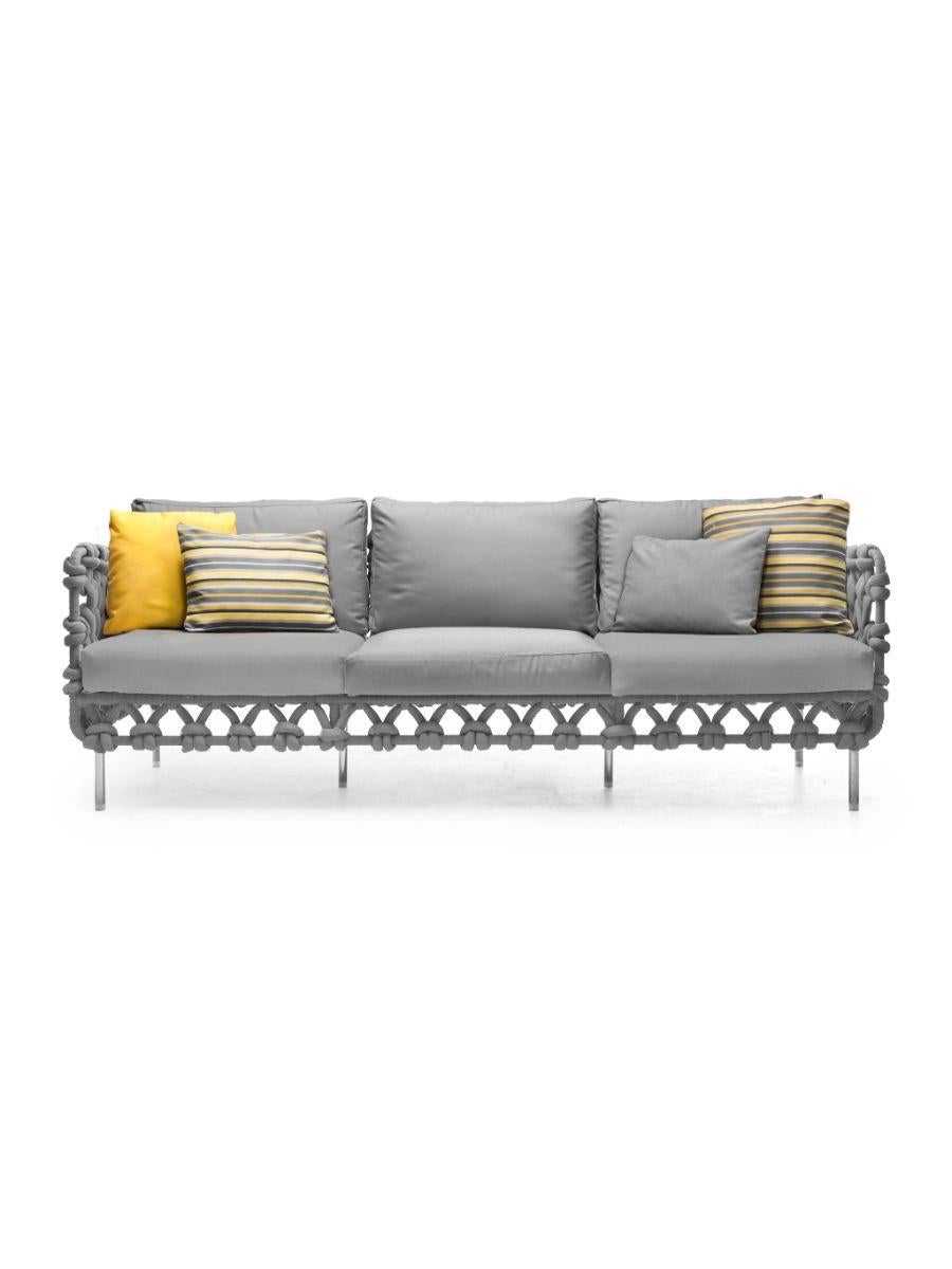 Cabaret sofa lowback by Kenneth Cobonpue
Materials: Polyester fabric, urethane foam, steel, and stainless steel.
Dimensions: 78cm x 214cm x H 64cm 

Cabaret wraps you in the warmth of its fabric layers like an oversized knit sweater. The