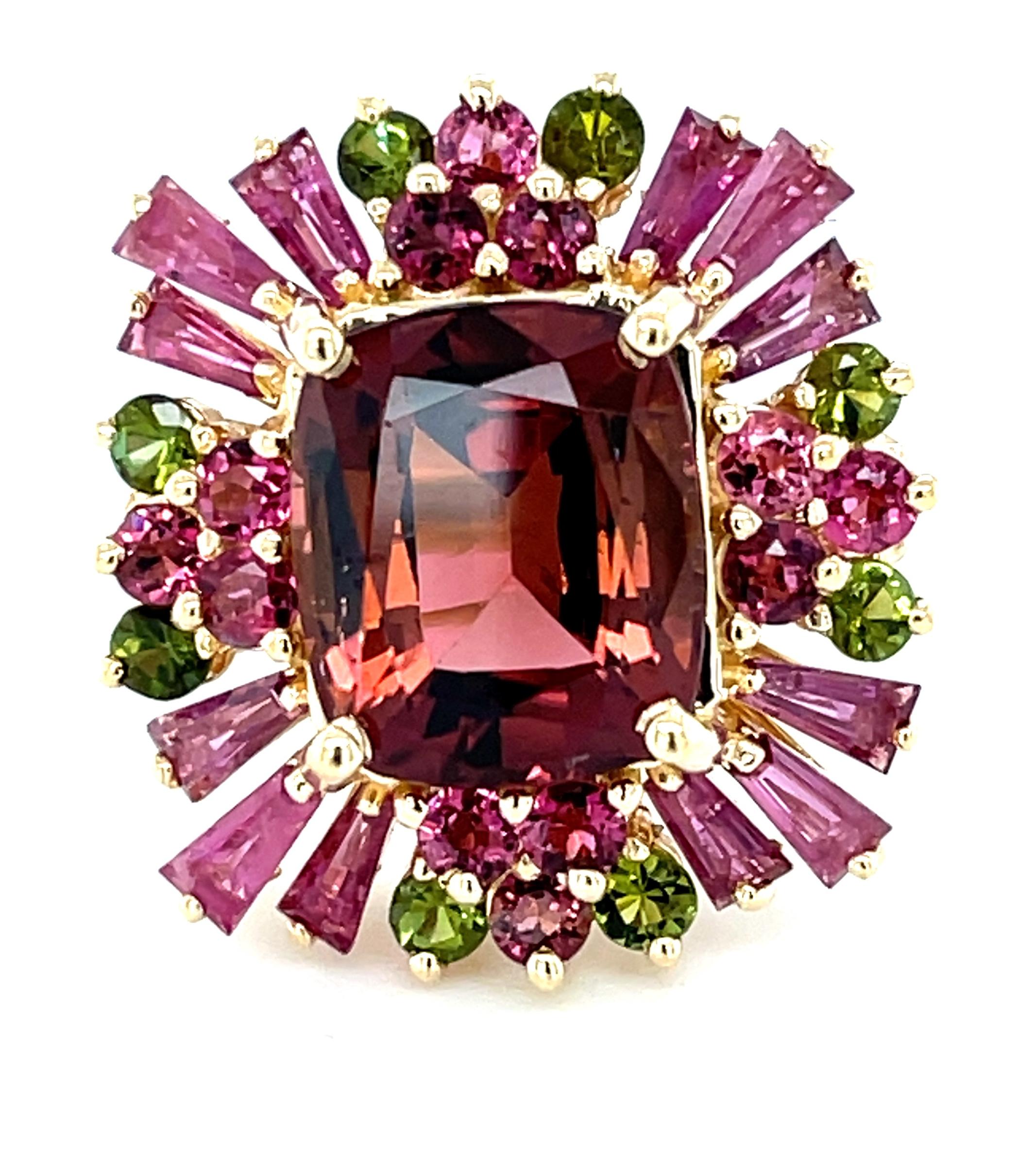 This beautiful colorful gemstone cocktail ring is so chic, fun, and eye-catching! A gorgeous wine-colored tourmaline weighing 7.57 carats sits center stage, accented with over 2 carats in ruby baguettes and sparkling pink and green tourmaline