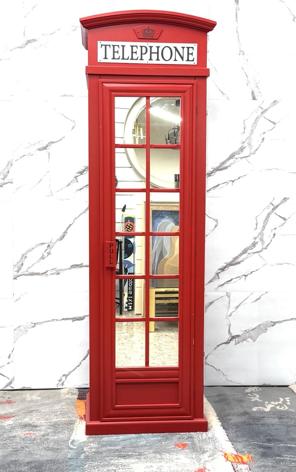Extraordinary wooden walk-in closet inspired by London's famous telephone booths. Painted in a brilliant lacquered red, this structure combines iconic aesthetics and functionality, transforming a simple closet into a dramatic and original piece of