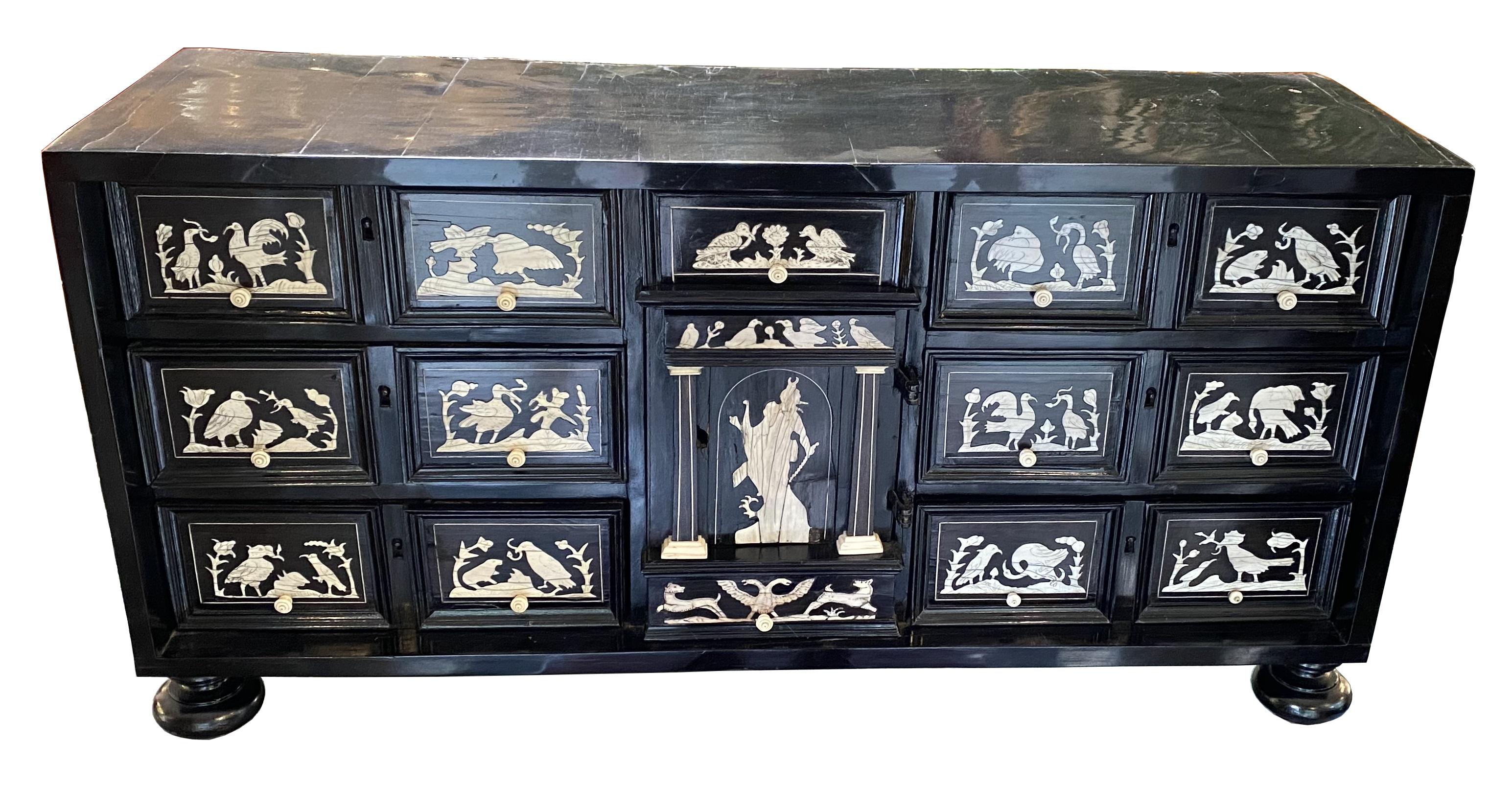 17th century cabinet from northern Italy, Milan.
Ebony veneer and bird decoration in ivory inlay.

Very good condition considering age.
Only restorations have been carried out over time, but the cabinet retains its unique patina and the construction