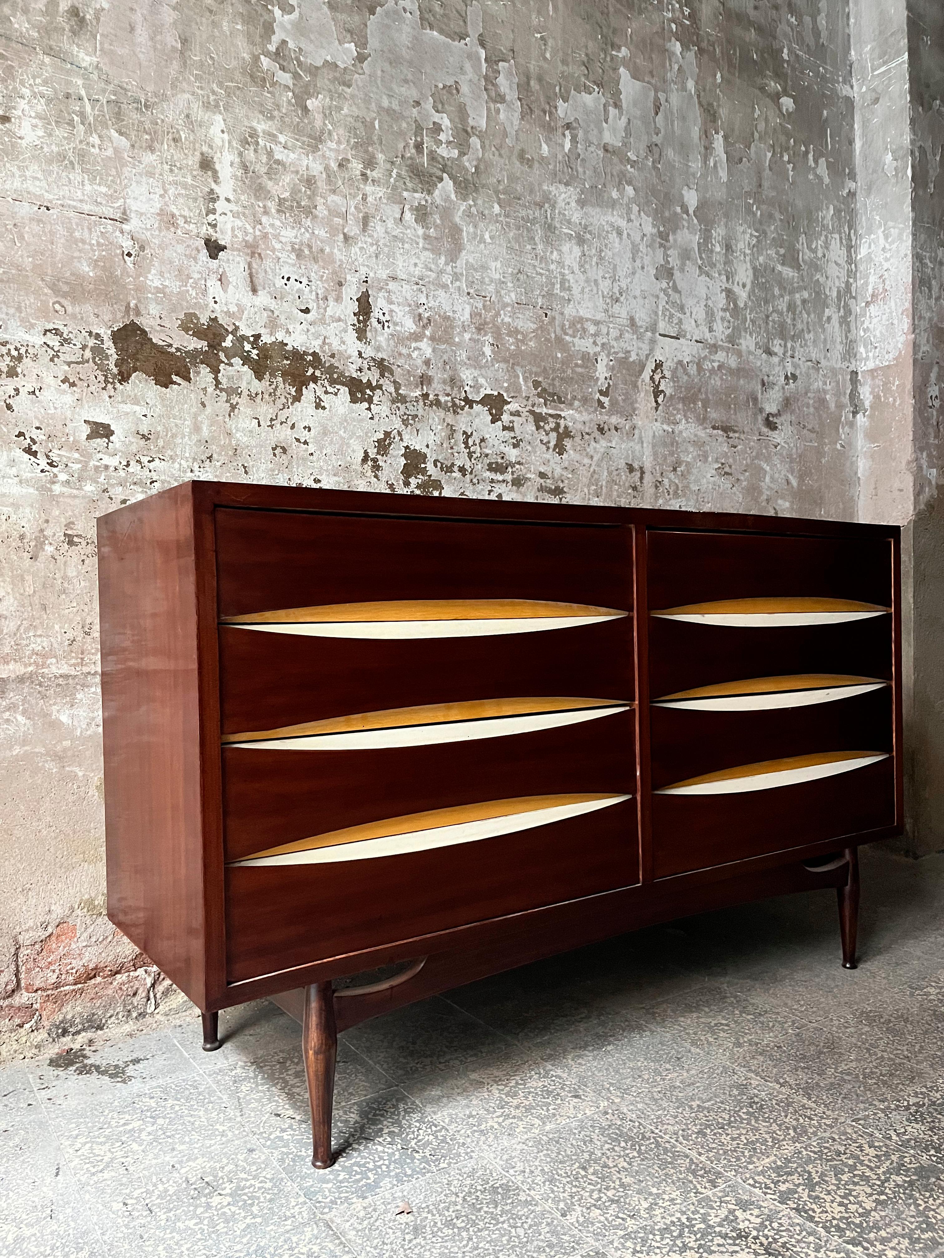 Discover the timeless elegance of the cabinet attributed to Arne Vodder, a true gem of 1960s design. This exquisite piece of furniture captures the essence and distinctive finishes that characterize the creations of the renowned Danish