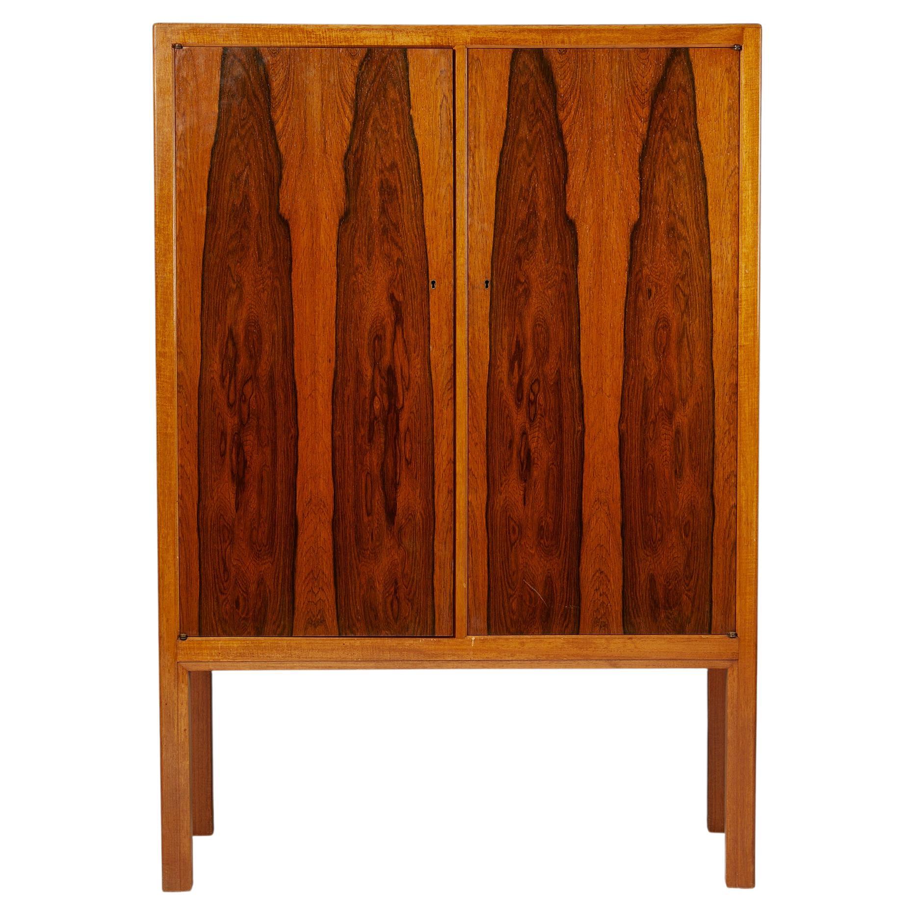 Cabinet, anonymous,
Sweden, 1950s.

Brazilian rosewood and mahogany.

Dimensions:
H: 136 cm / 4' 5 1/2