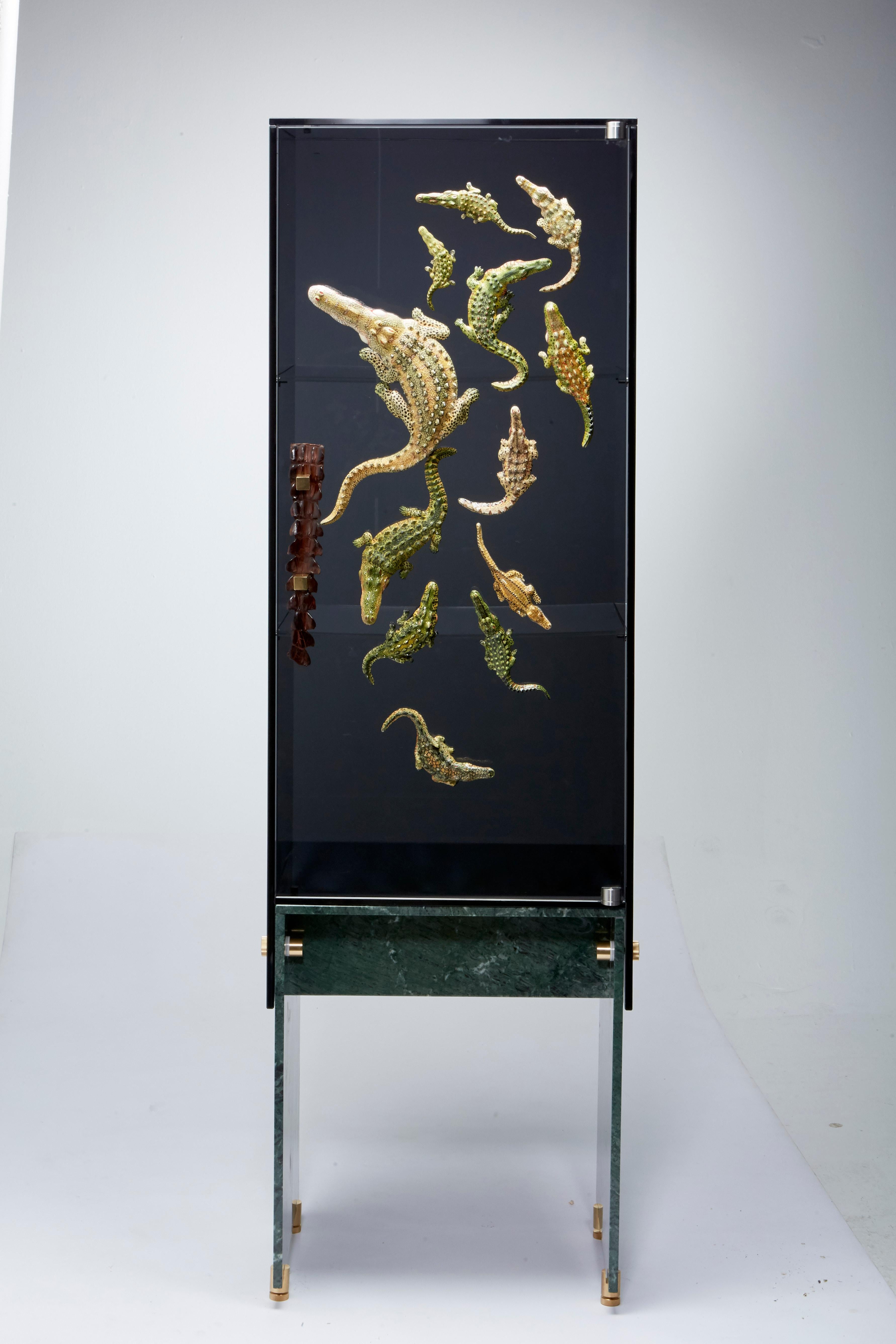 Cabinet Big Crocco by Egg Designs
Dimensions: 55 L X 42 D X 180 H cm
Materials: Ardmore Ceramic, Glass, Marble, Genuine Crocodile Tail

Founded by South Africans and life partners, Greg and Roche Dry - Egg is a unique perspective in contemporary