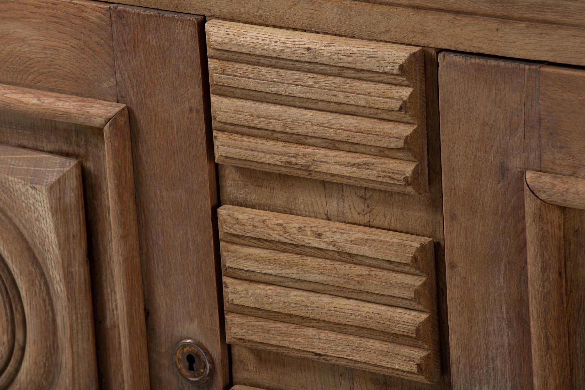 Cabinet, Bleached Oak, France, 1940s

Echoing the Vernacular Modernism of French Provincial Workshops Influenced by Art Deco

Tactile and totemic, this 1940s French oak cabinet summons the language of rural modernism—where sculpture met storage, and