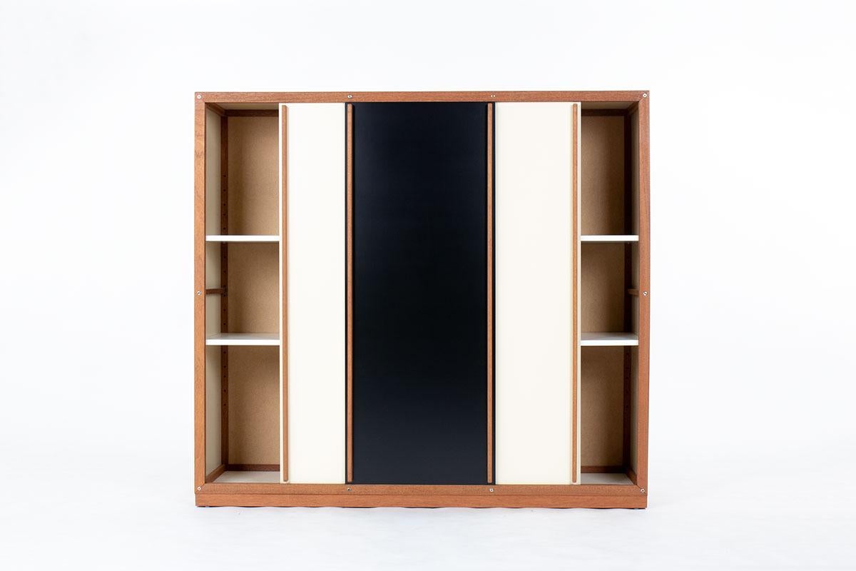 Large cabinet made by French cabinetmaker Andre Sornay in the sixties
Structure in mahogany with a tigette system
Panels in beige and black lacquer
Shelves inside