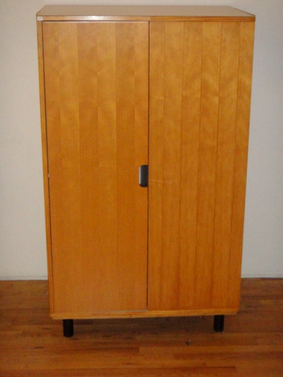 Single door cabinet in pine wood made for a Les Arcs ski resort in Savoie, France. Has one door that opens to hang clothes and the right side of the cabinet is open with two shelves. Shown without the shelves and bar for hangers.