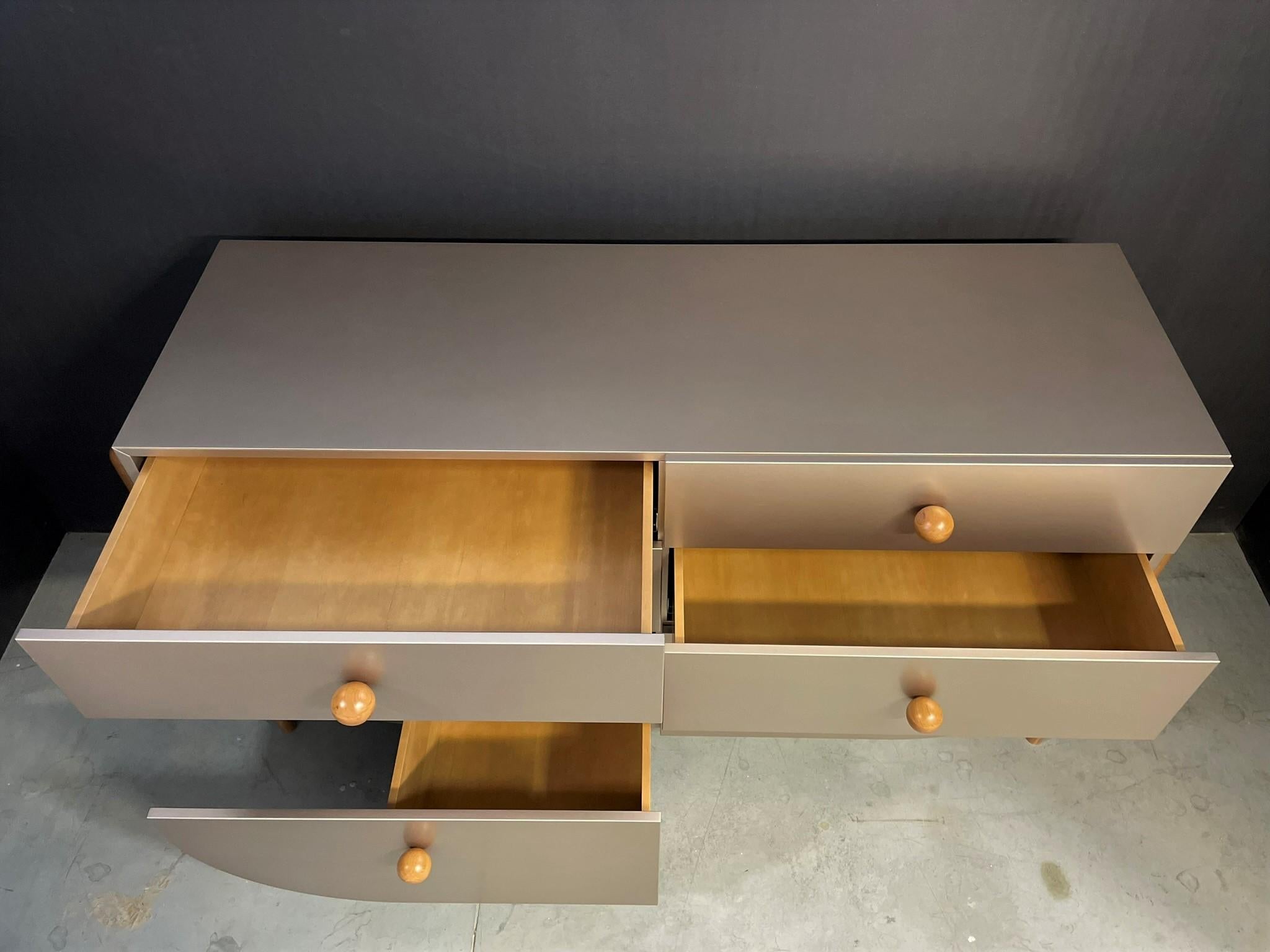 Metallic painted sideboard gives shinning effect and enriches the room interior. 
Solid wooded legs are the accent of completeness and make this furniture unique. Comparable 6 drawers give space to store small items or clothes and furniture could
