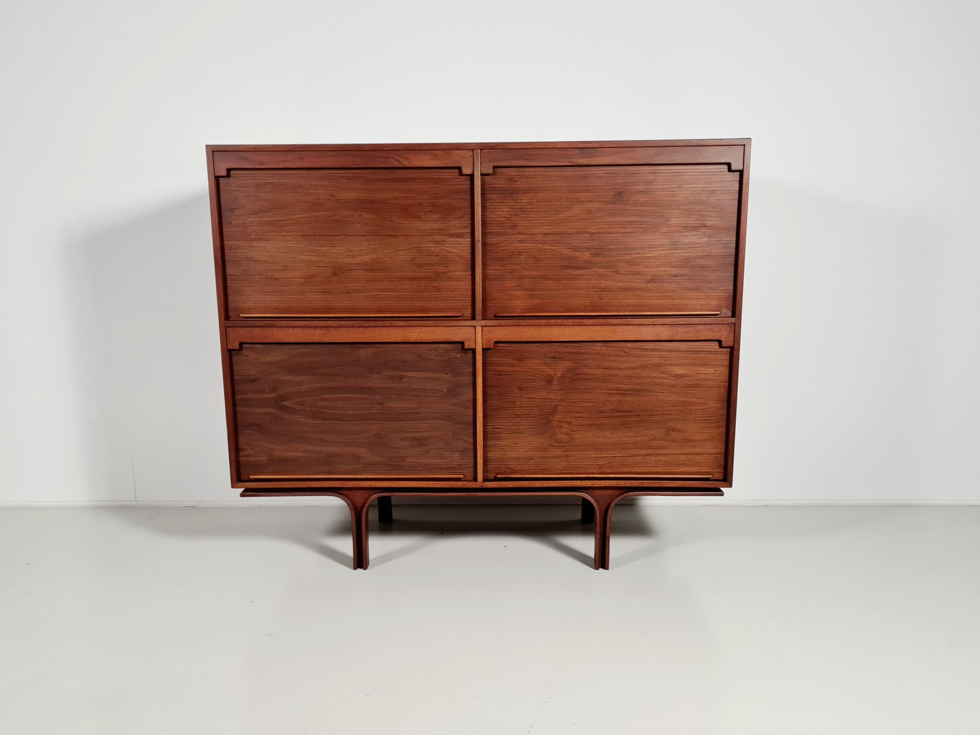 Hardwood with walnut veneer cabinet with shutters designed by Gianfranco Frattini for Bernini. Manufactured in Italy in the 1960s.