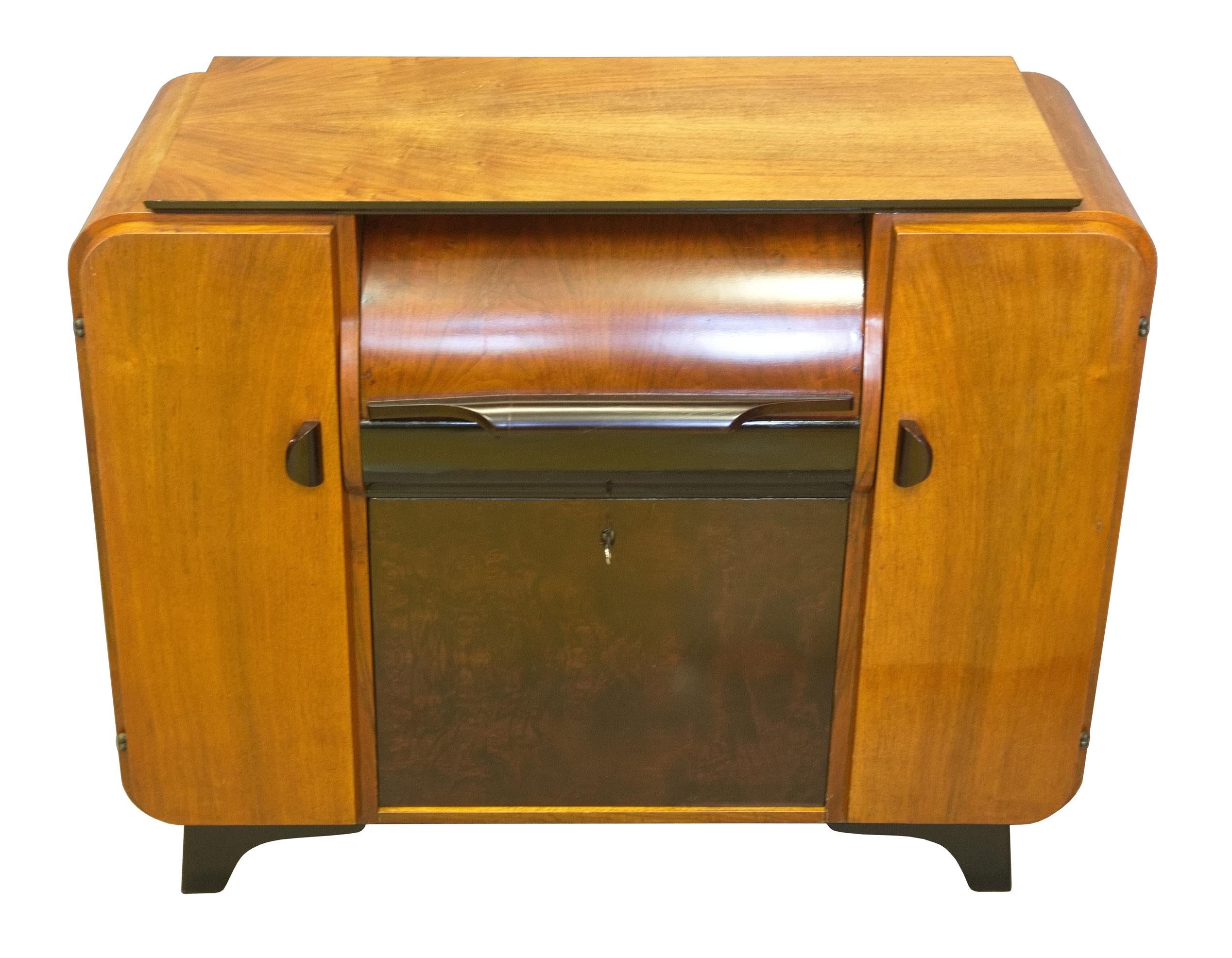 This music cabinet was originally designed by Jindrich Halabala in the 1930s and was produced by renowned UP Brno Furniture factory. Due to its popularity it stayed in production after the WW2 and was made in various types until the 1960s. The