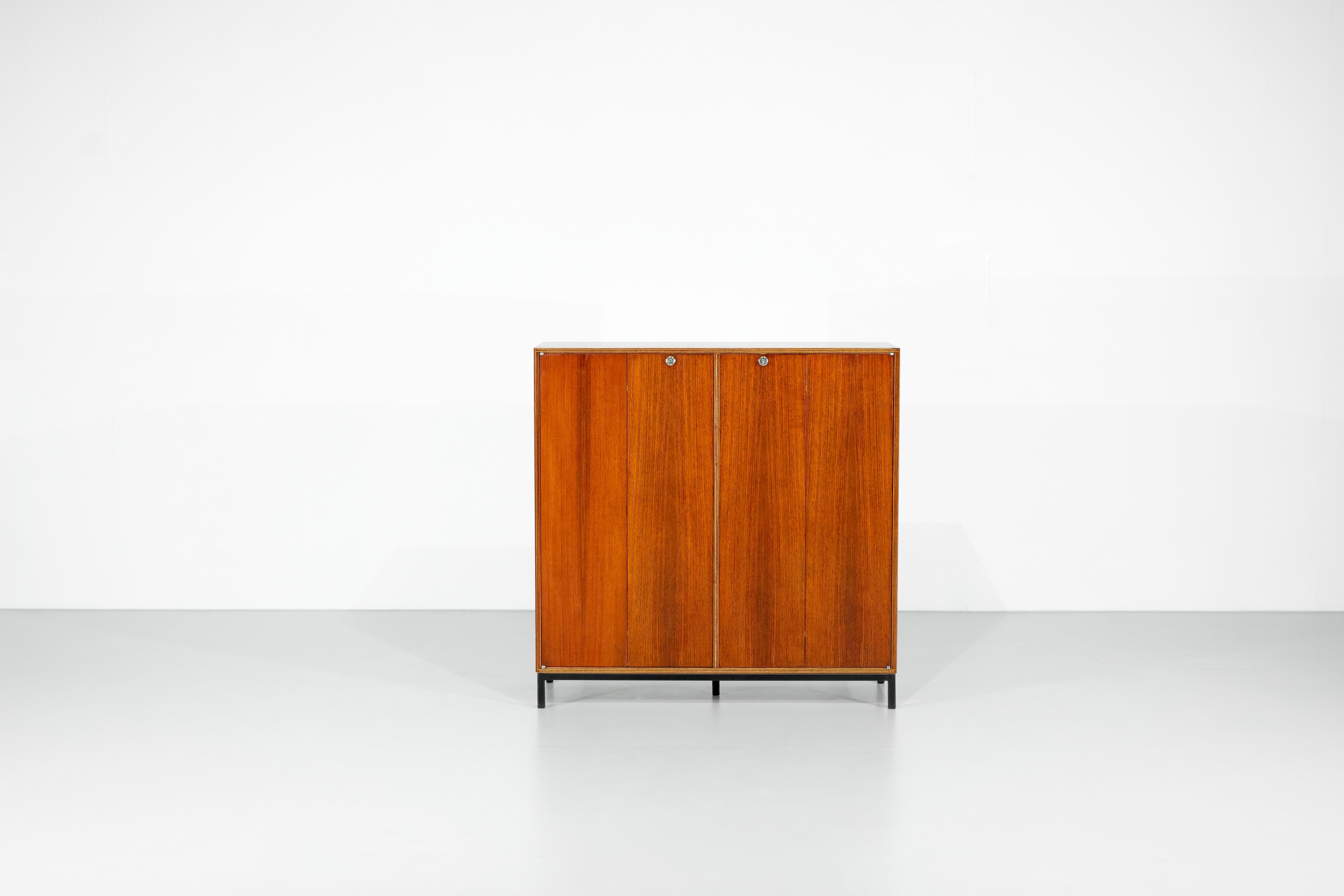 Sideboard Cabinet in wood designed on black metal base (not original), the butterfly doors are nice details, with the key.

Beautiful wood restoration.

Designed by Jules Wabbes for Le Mobilier Universel, Belgium 1960s.

 

Designer - Jules