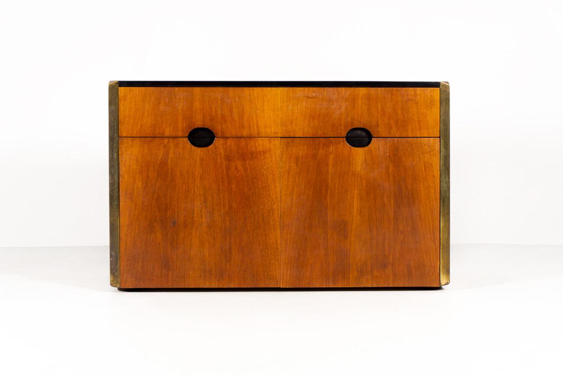 This beautifully crafted cabinet was designed in 1961 by the Italian architect, designer and urban planner Luigi Cacchia Dominioni. Made of walnut with brass edges and black lacquered recessed handles.
Manufactured by Azucena, Milan.

