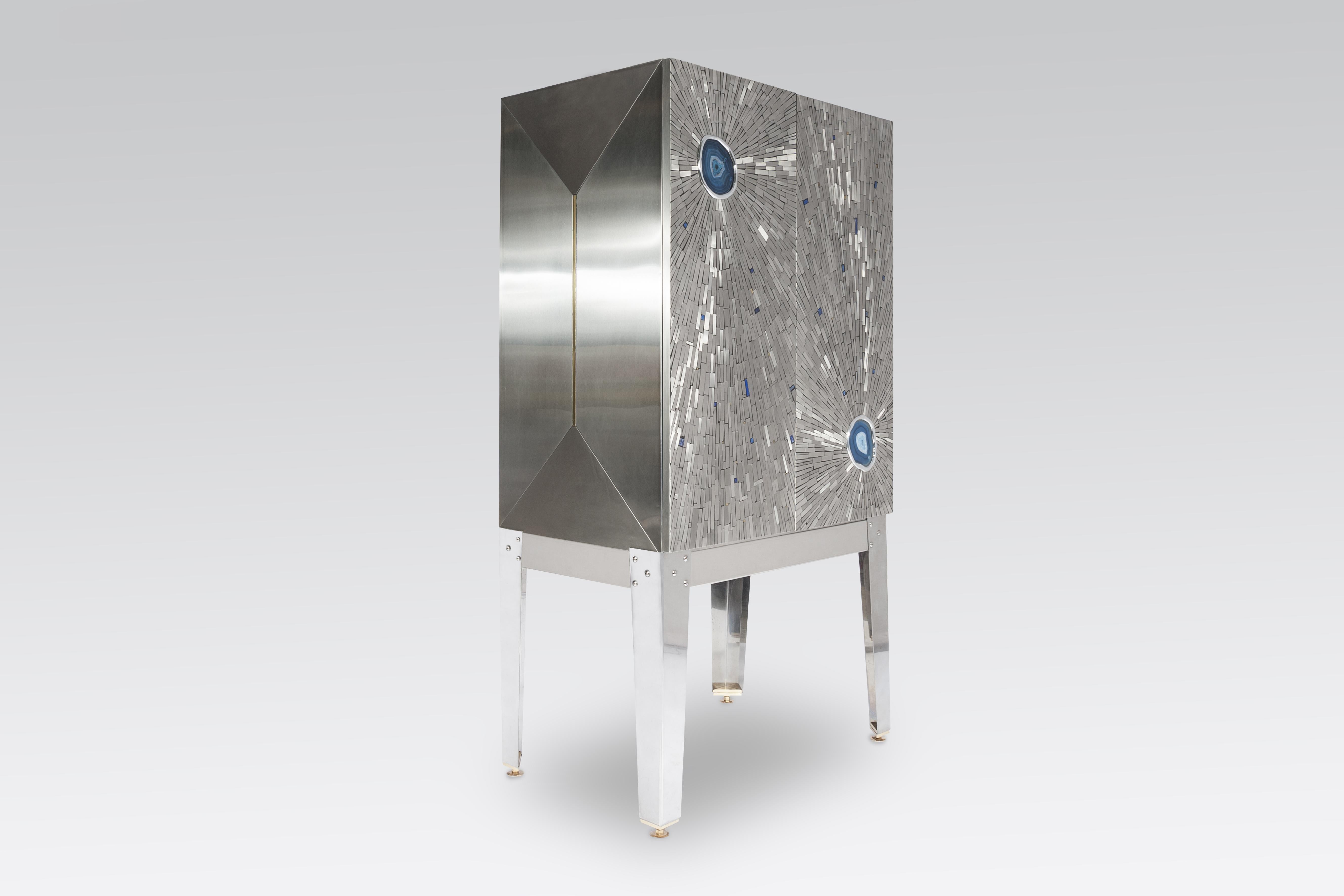 Created to measure by Stan Usel, this cabinet of stainless steel and brass is inserted with a magnificent agates stones highlighting a mosaic radiation. Different utility (bar, wardrobe, shelf) Each piece is topped with unique stones and is